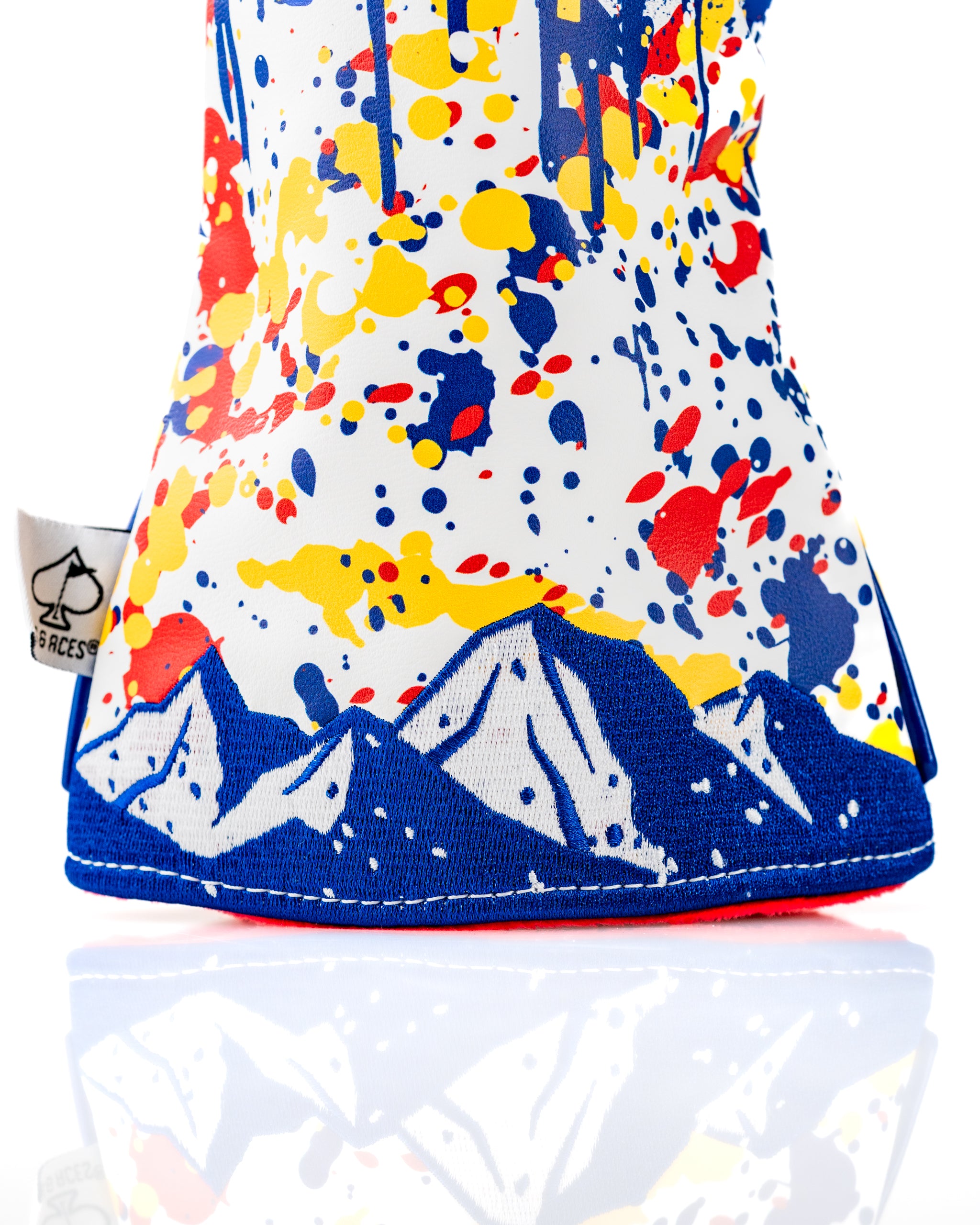 Bold Colorado 2.0 headcover set featuring a vibrant design with splashes of color and mountain graphics, perfect for golfers.