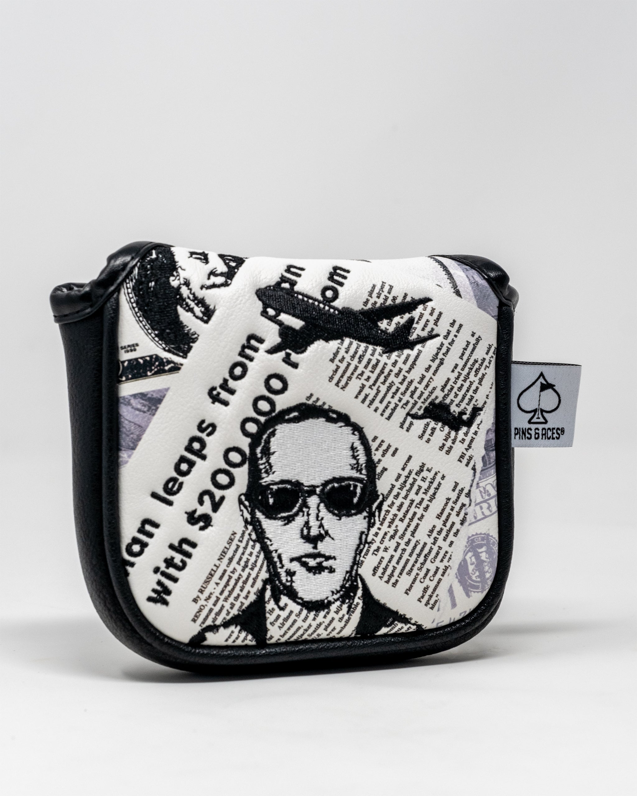 D.B. Cooper mallet putter cover featuring a unique design, black and white color scheme, and embroidered logo.