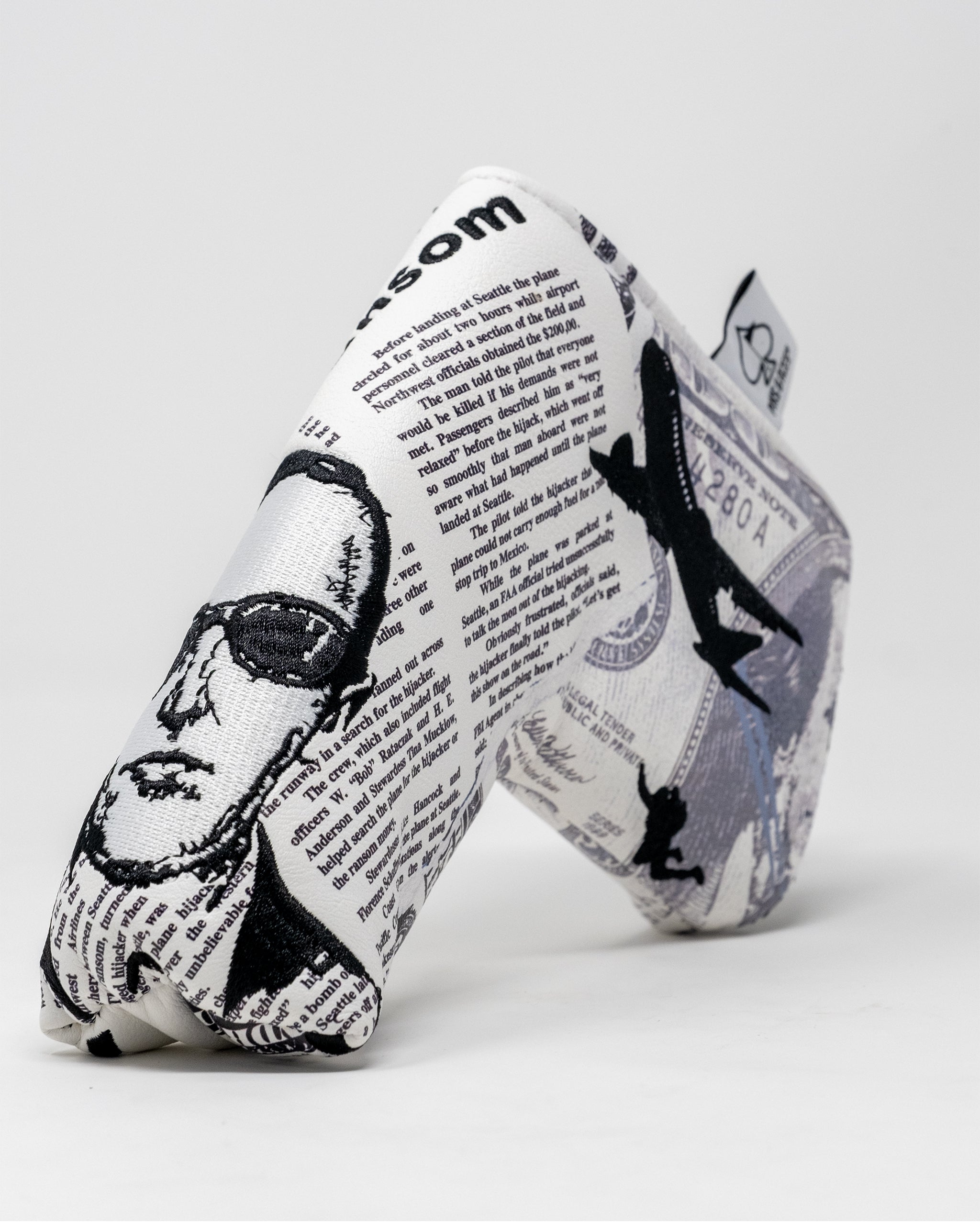 D.B. Cooper Blade Putter Cover featuring a sleek design with bold graphics and a secure fit for golf clubs.