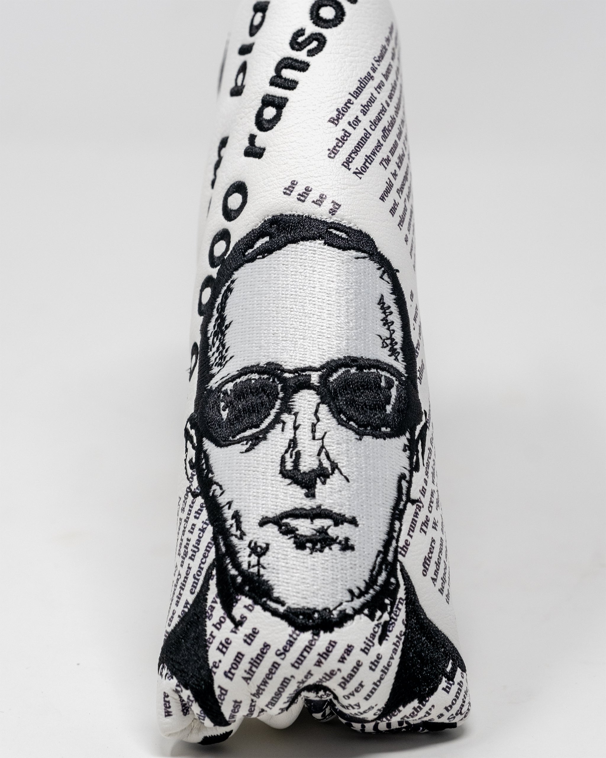 D.B. Cooper Blade Putter Cover featuring a sleek design with a vintage-inspired pattern and secure fit for golf clubs.