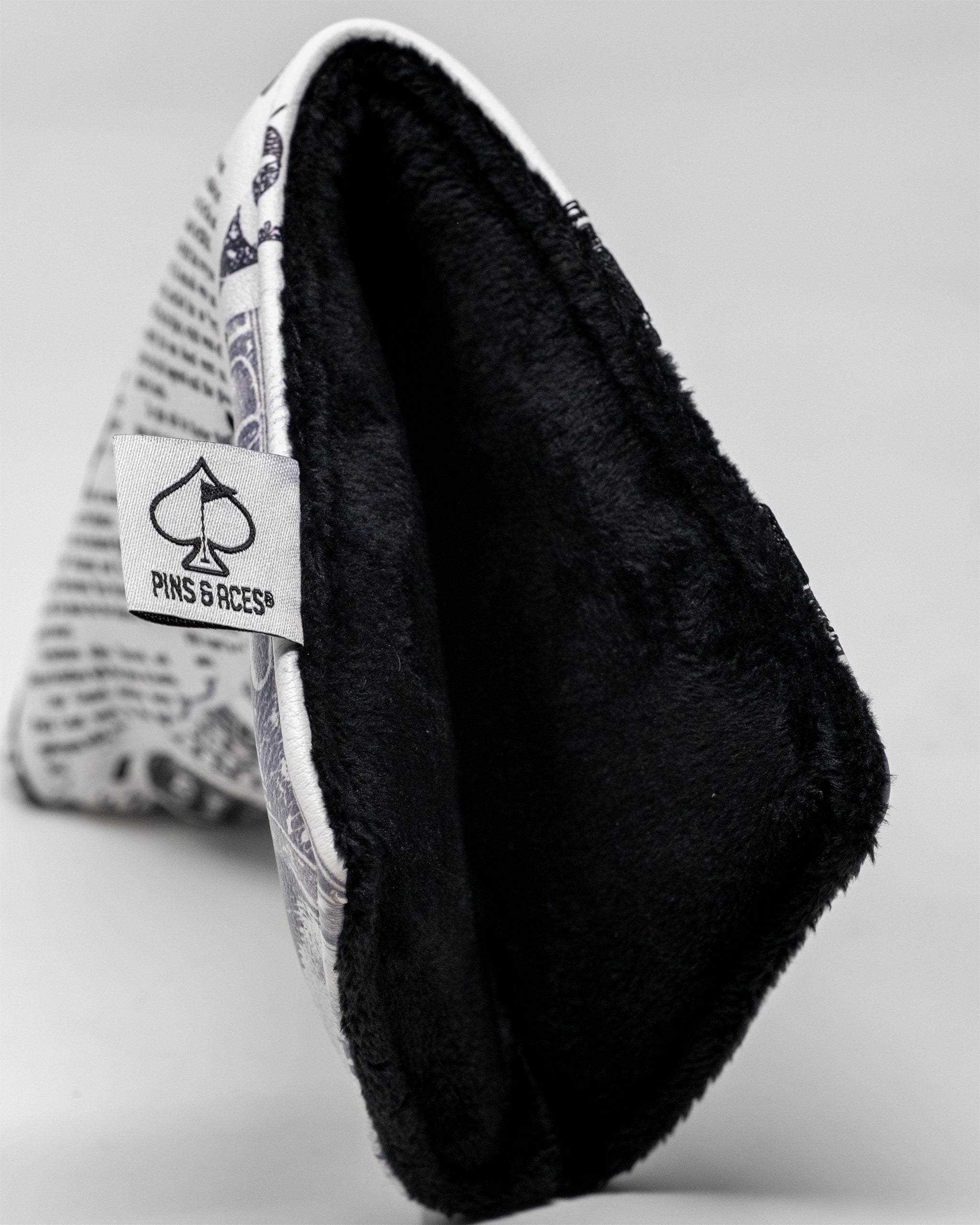 D.B. Cooper Blade Putter Cover featuring a sleek design with vibrant colors and a graphic print.