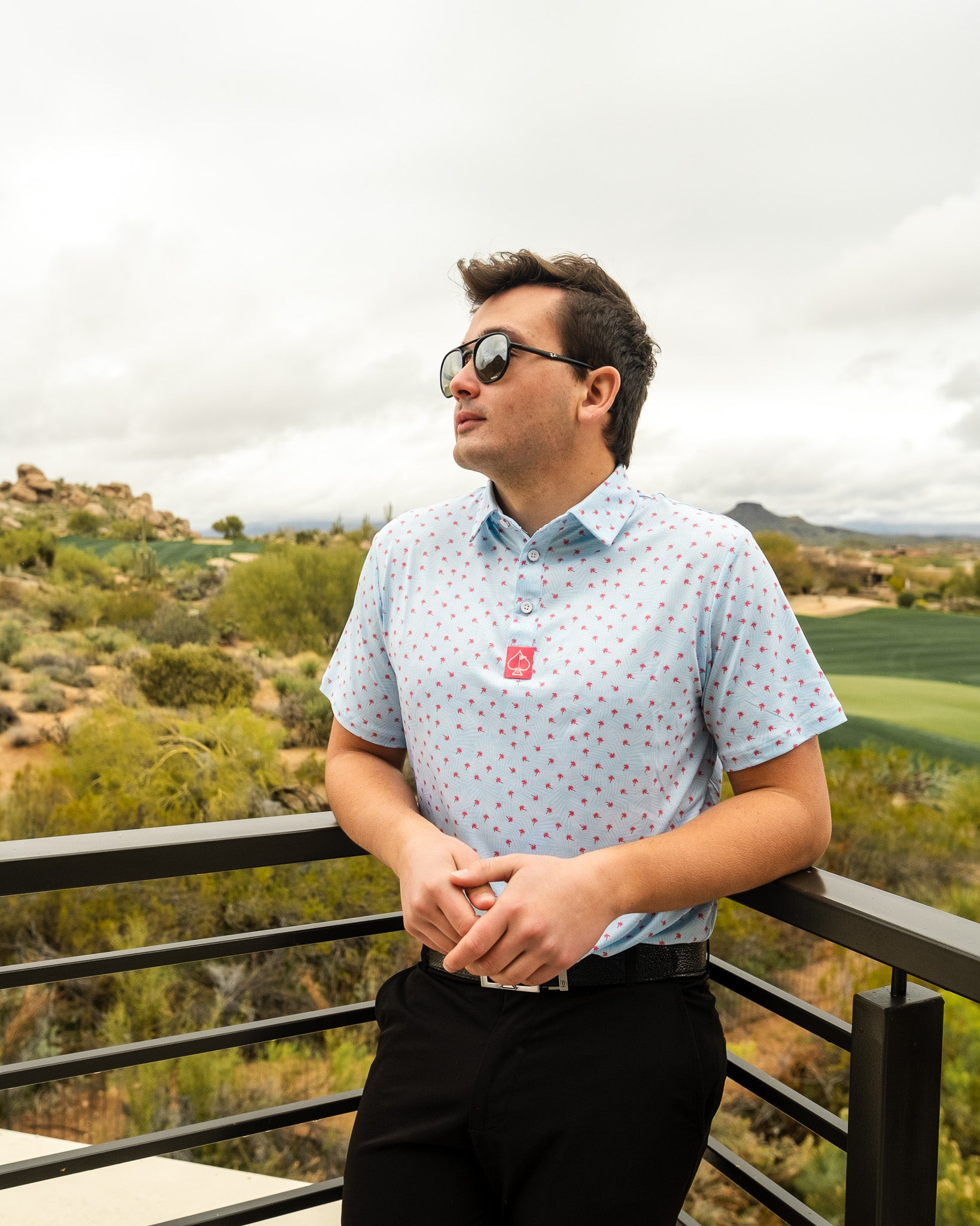 Palm Sunday Blue floral arrangement in a glass vase, featuring vibrant blue blooms and greenery.