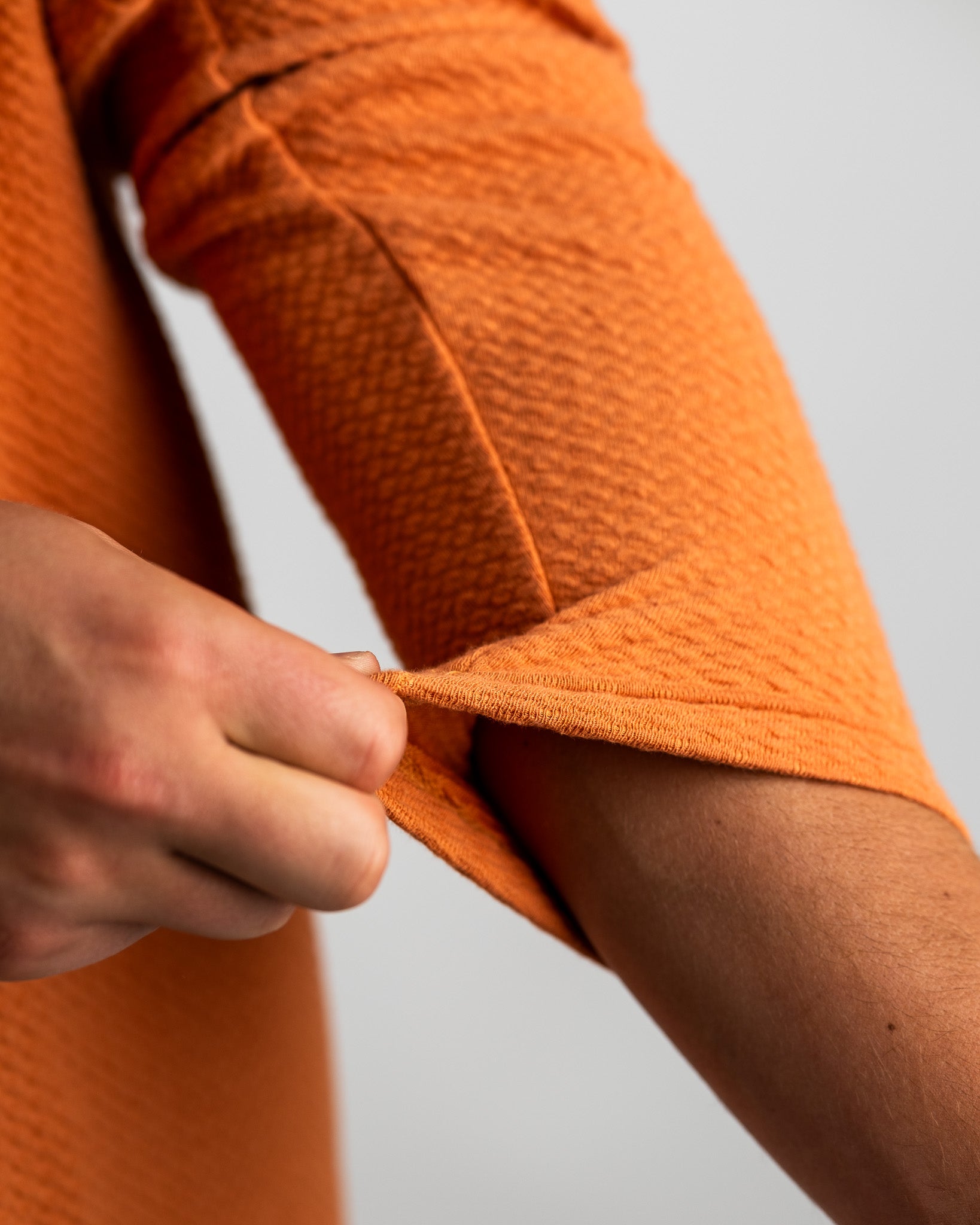 Player Preferred™ Waffle Knit Pullover in Pumpkin color, featuring a textured knit design and a relaxed fit.