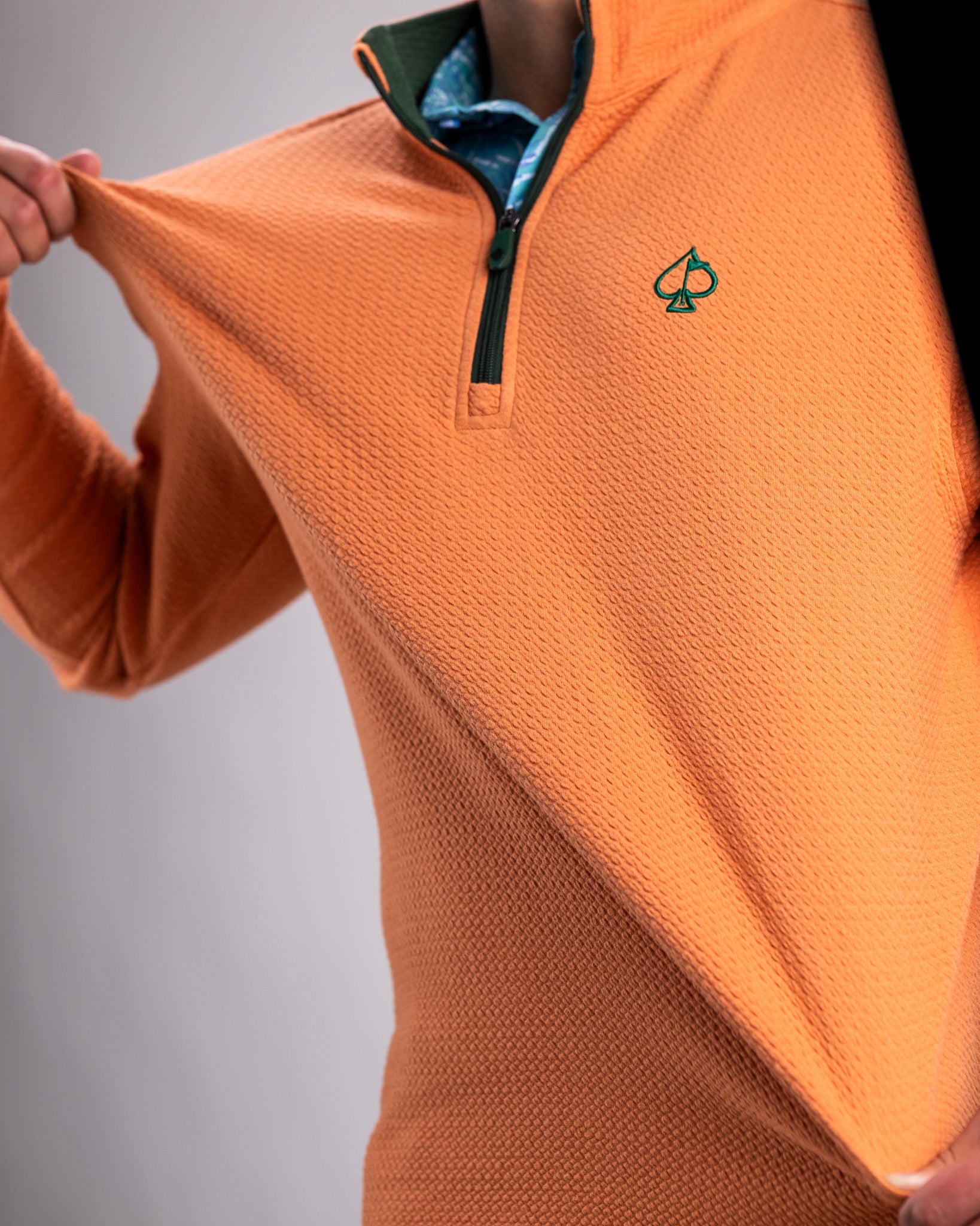 Player Preferred™ Waffle Knit Pullover in Pumpkin color, showcasing a cozy design with a textured knit pattern.