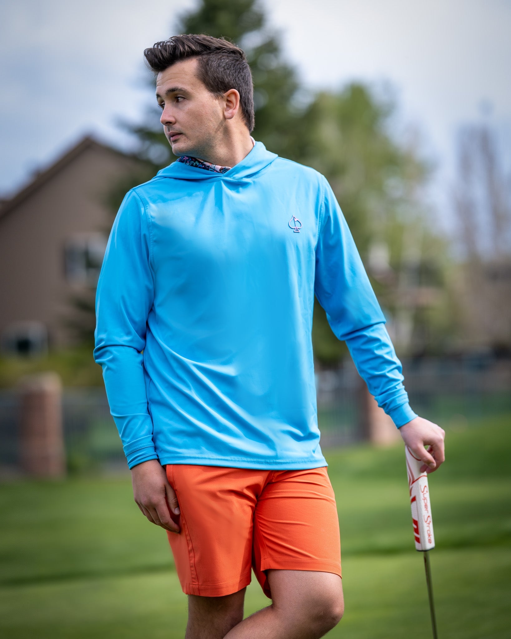 Performance shorts in melon color, featuring an elastic waistband and moisture-wicking fabric, displayed on a neutral background.
