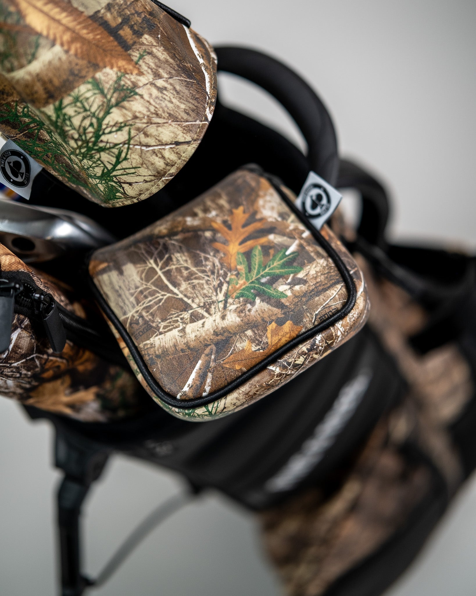 Realtree mallet cover featuring a camouflage pattern, designed for golf clubs.