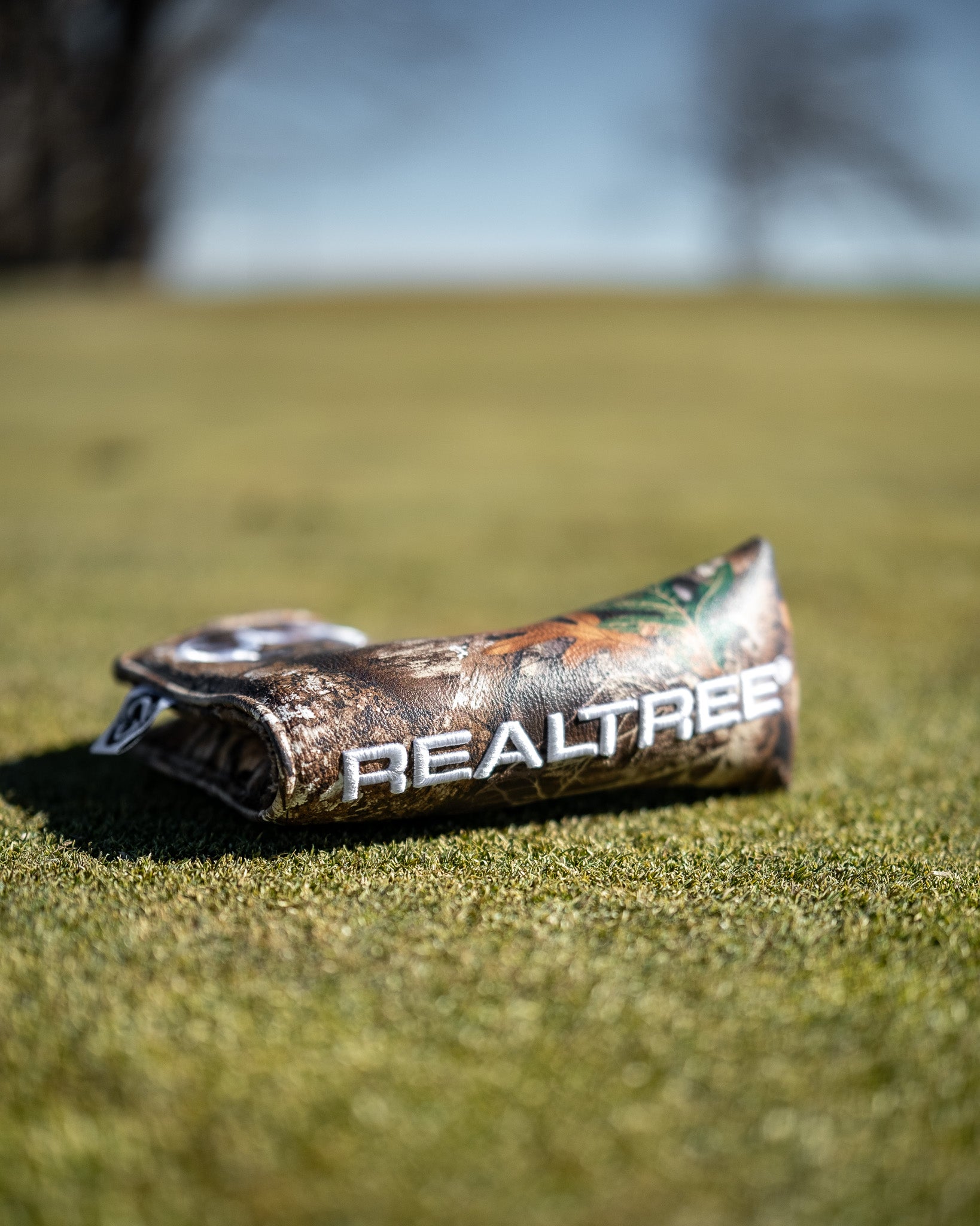Realtree Blade Cover featuring a camouflage design, ideal for outdoor enthusiasts.