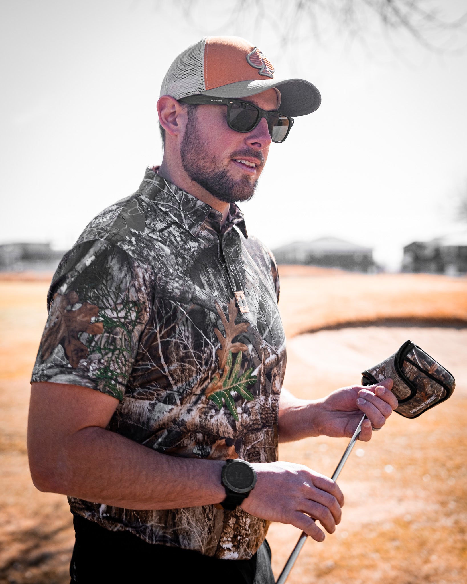 Men's Realtree Edge Polo shirt featuring a camo pattern and a comfortable fit, ideal for outdoor activities.