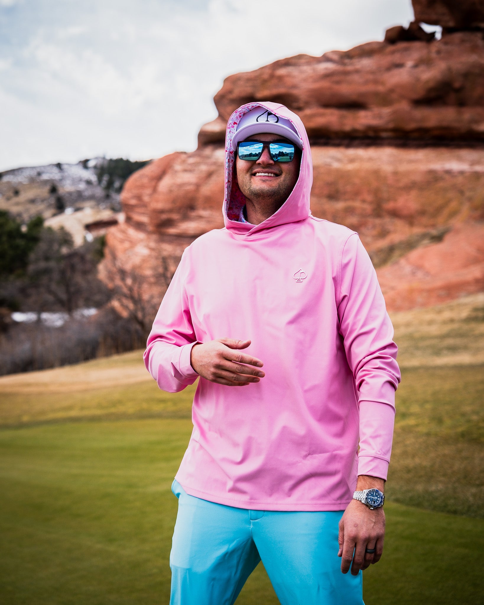 Performance Golf Hoodie in Flamingo Shatter design, featuring a vibrant pink and blue abstract pattern.
