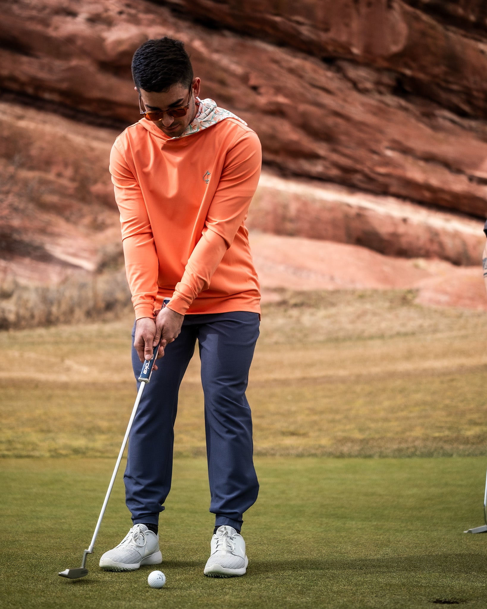 Performance Golf Hoodie featuring a vibrant Birds of Paradise print.