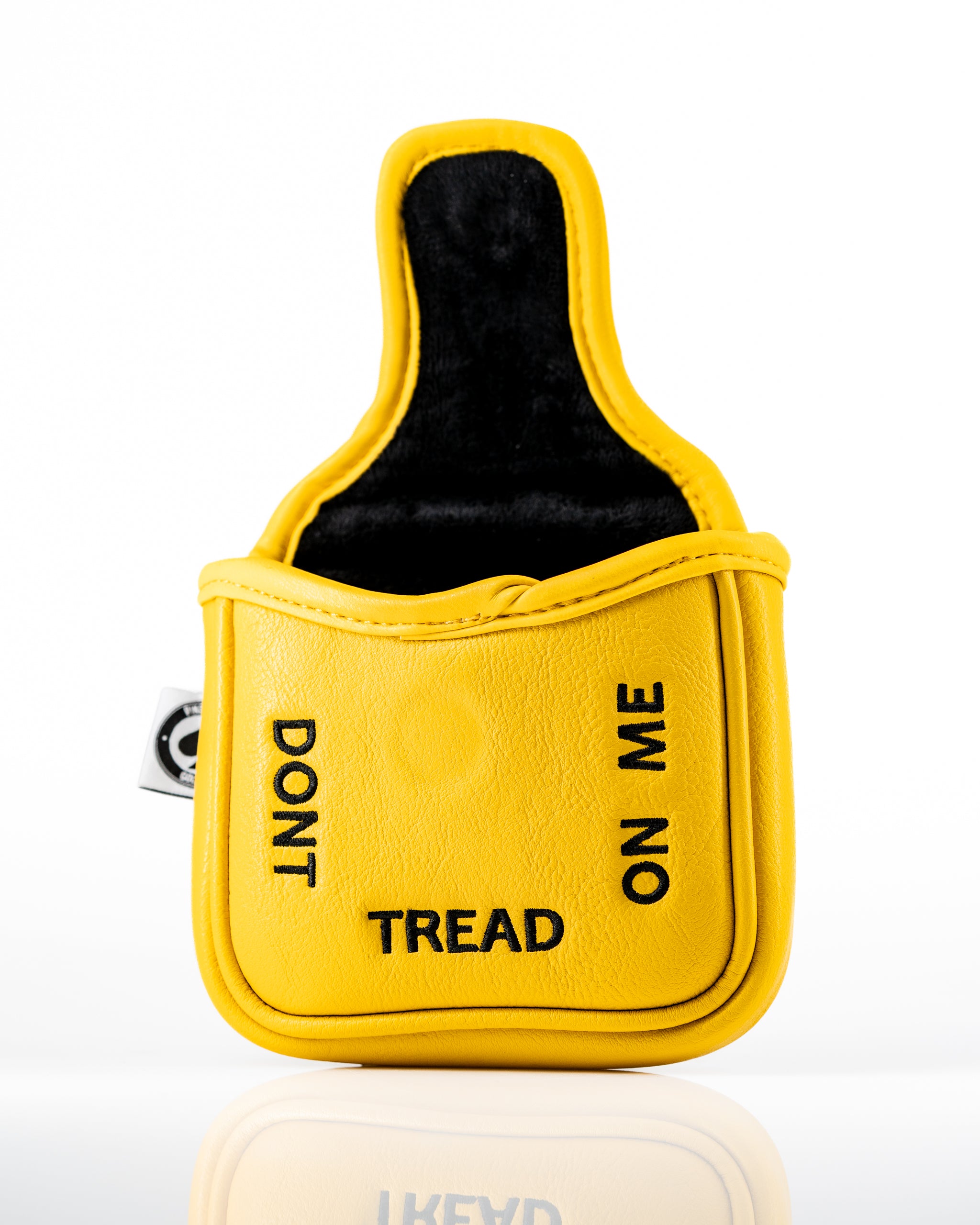Bold yellow mallet putter cover featuring "Don't Tread on Me" text, designed for golfers who want to make a statement.
