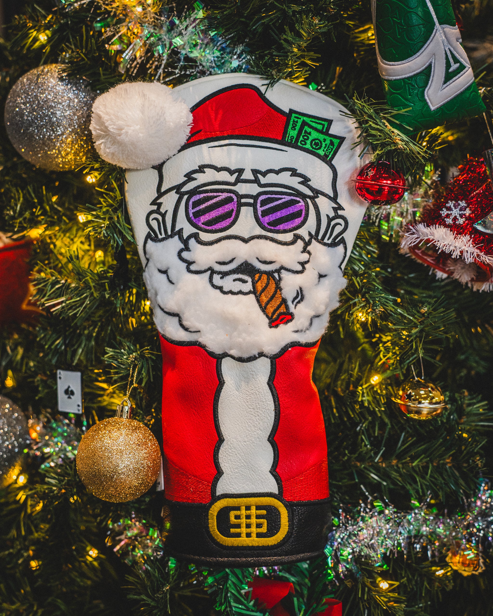 Santa Degenerate driver cover featuring a whimsical Santa Claus design in vibrant colors, perfect for adding holiday cheer to golf equipment.