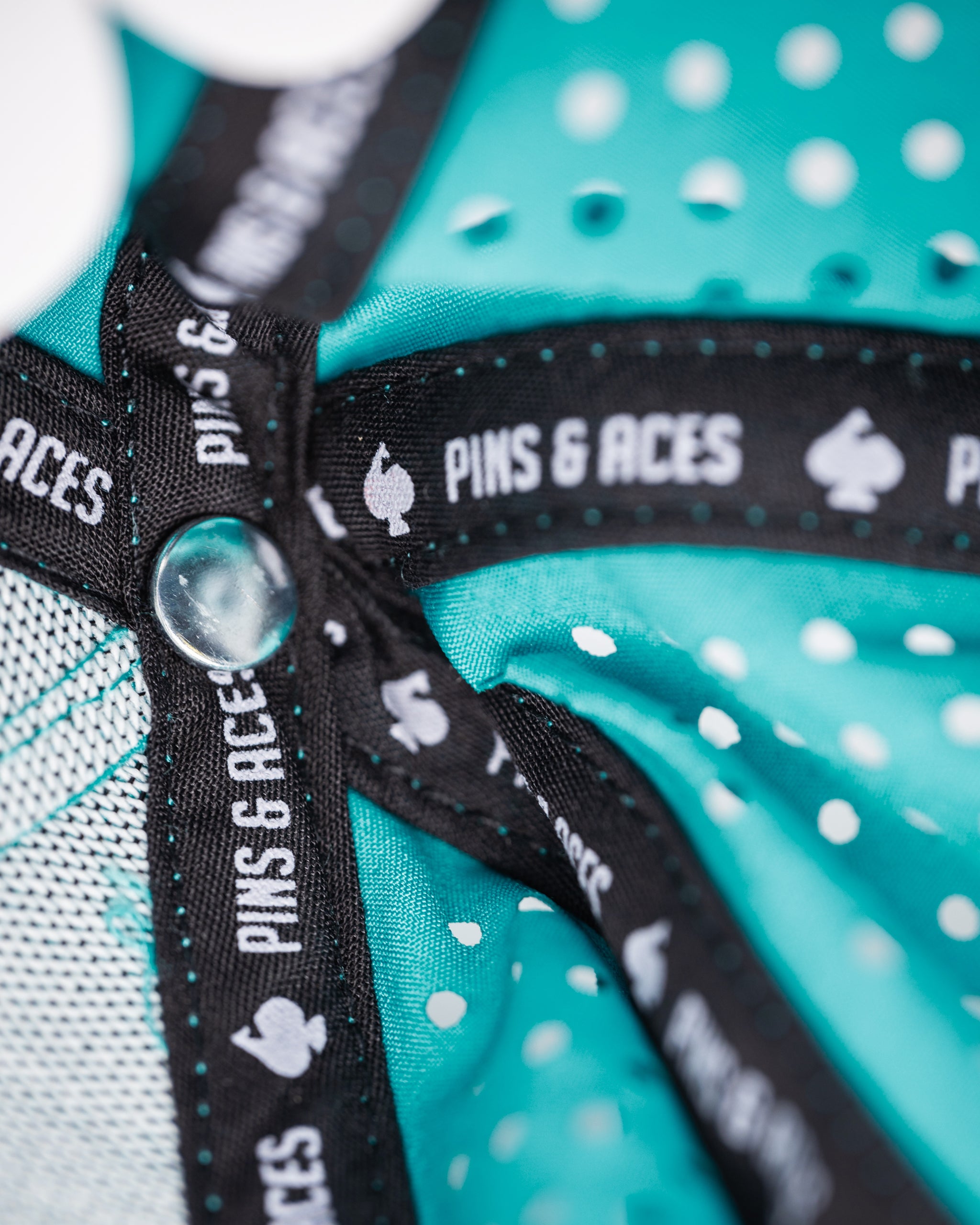 Perforated baby blue rope hat with "Beaver Liquor" logo.