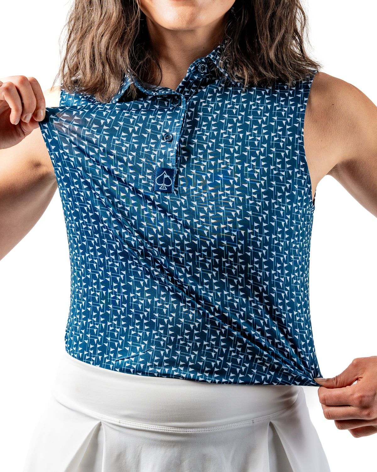 Navy and white women's golf polo featuring a flag stick pattern, designed for comfort and style on the course.