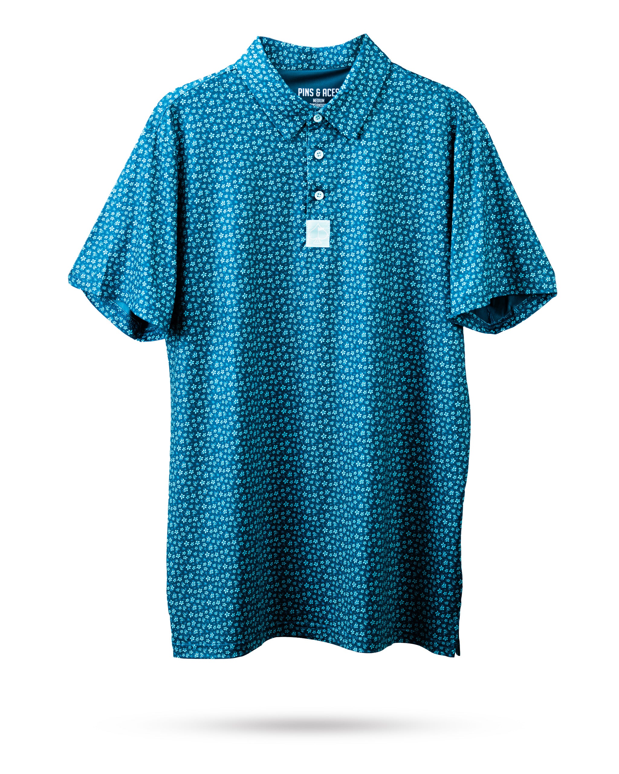 Micro Floral Blue Polo Shirt featuring a delicate blue floral pattern on a dark background.