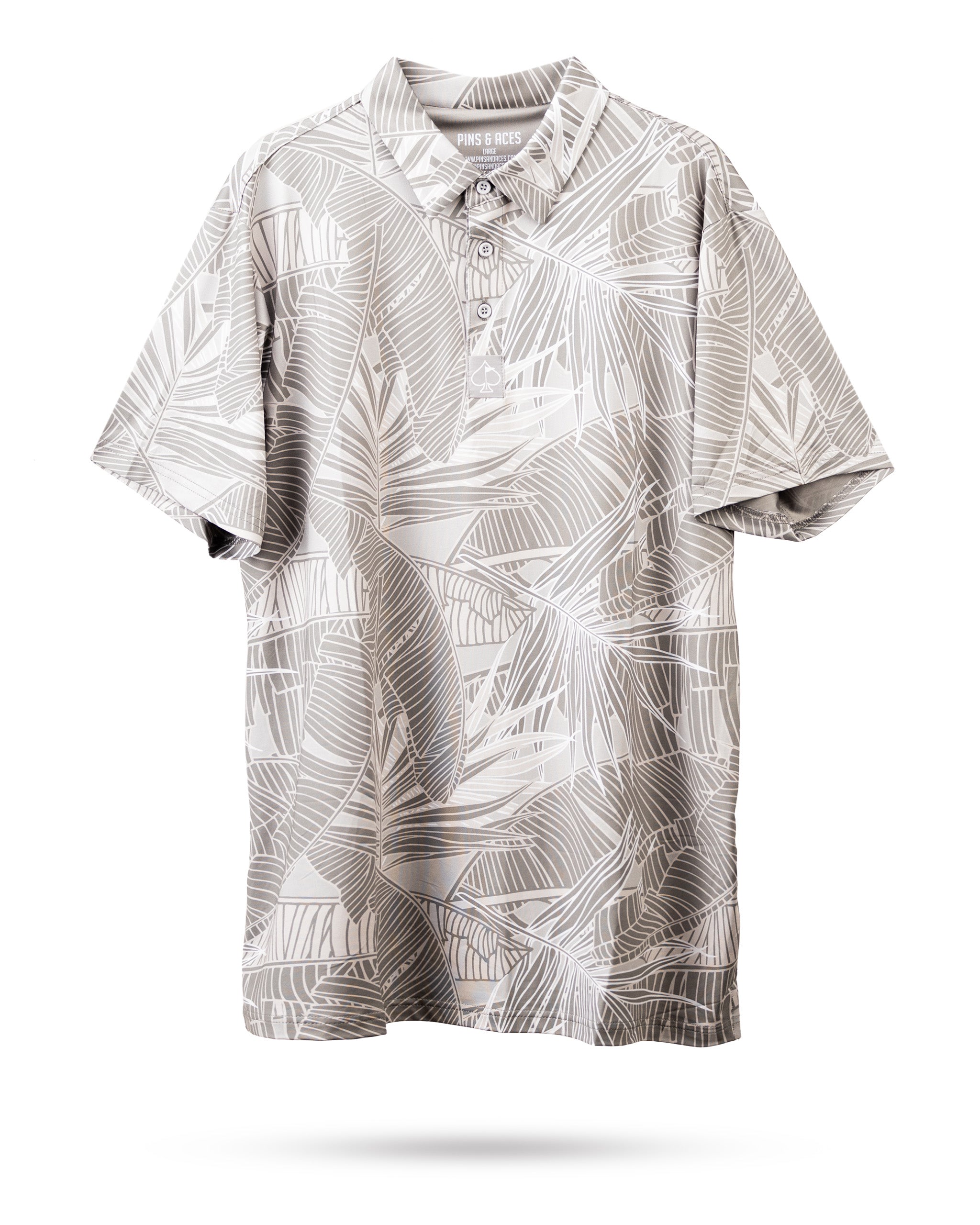 Colorful palm leaves pattern on a polo shirt, showcasing vibrant greens and tropical hues.