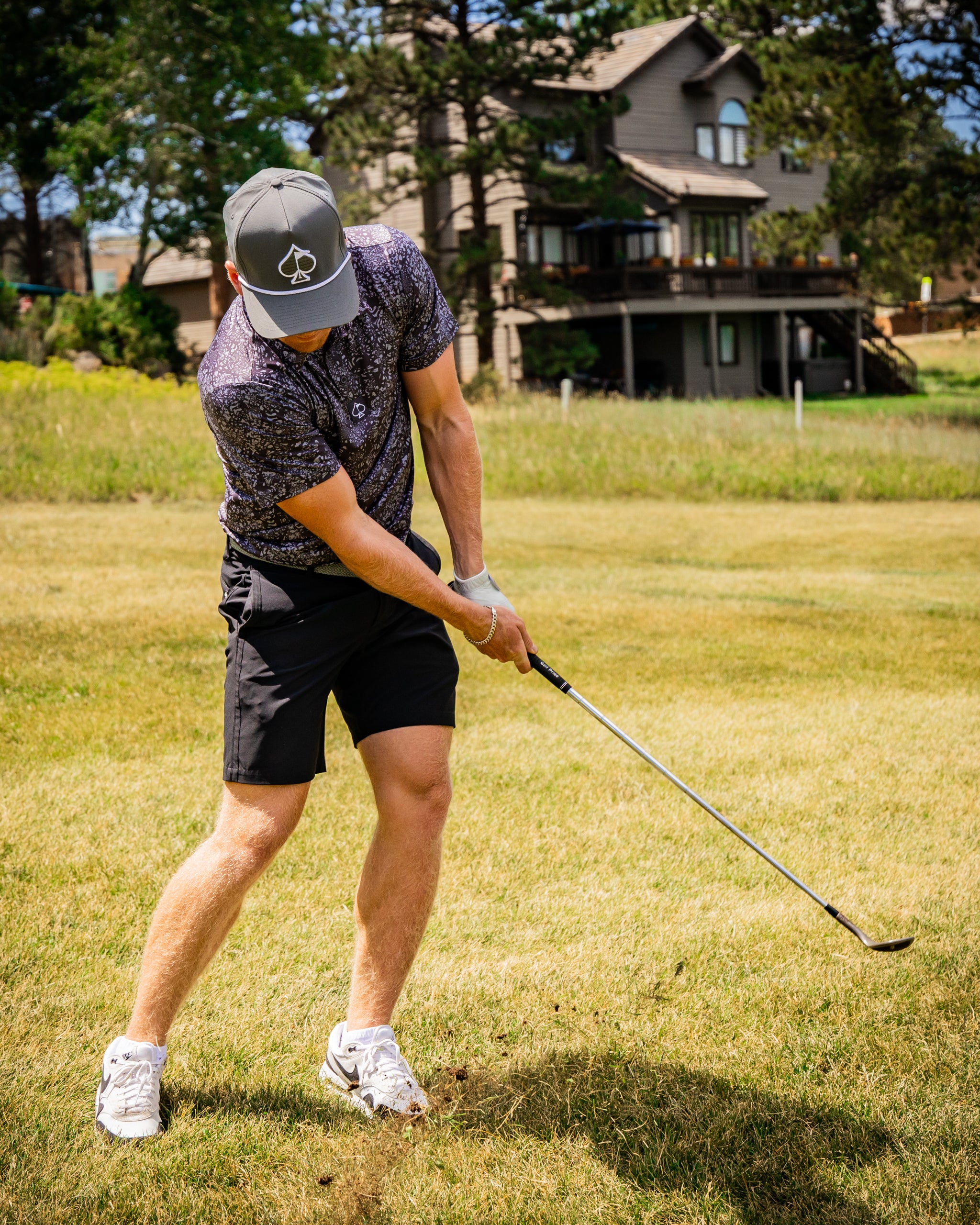 Volcanic ash in a textured, natural form, with a deep gray color and fine particles, set against a neutral background.