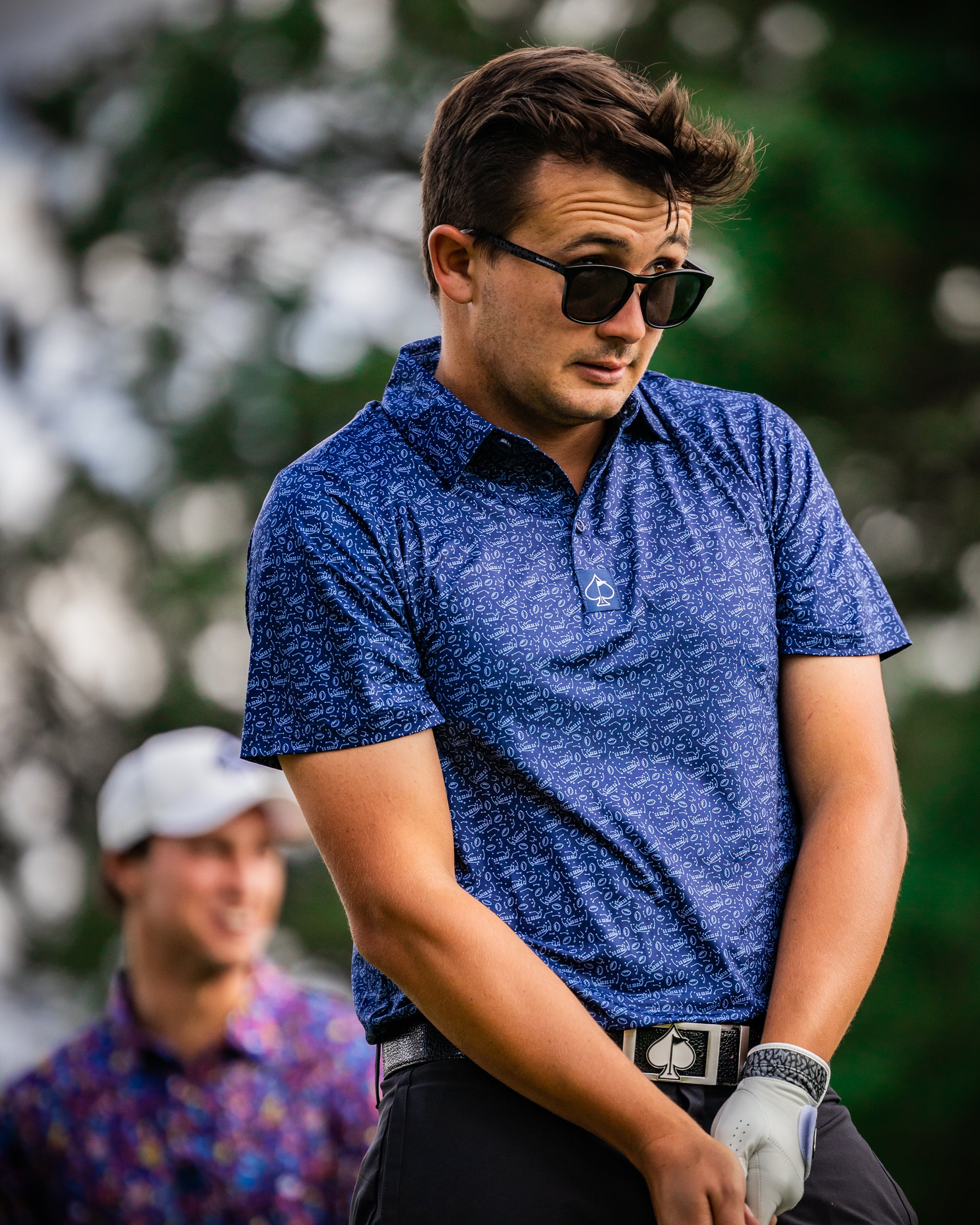 Men's Playmaker polo shirt in deep blue with a classic collar and short sleeves, displayed on a neutral background.
