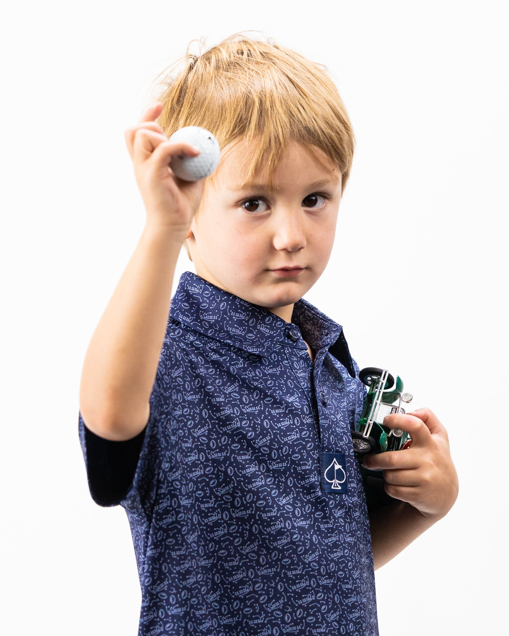 Youth Playmaker polo shirt in vibrant colors, designed for active kids, featuring a classic collar and short sleeves.