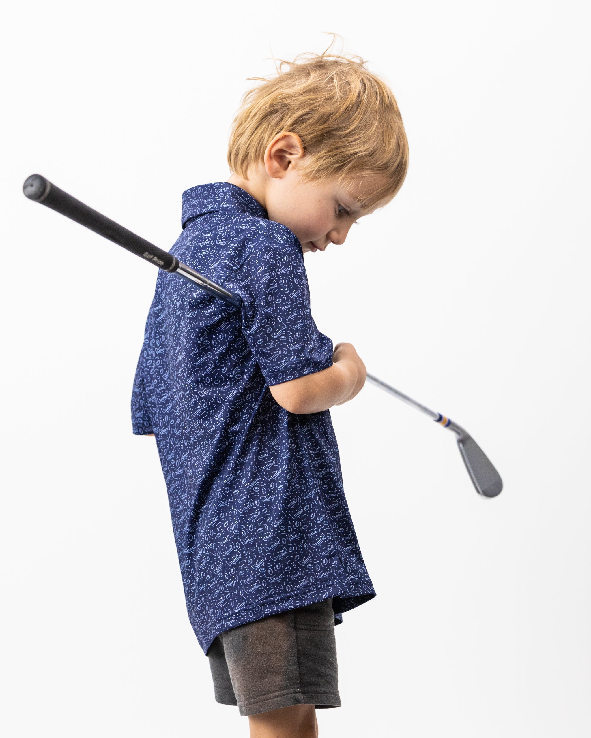 Youth Playmaker polo shirt in navy blue, featuring a classic collar and short sleeves, designed for active wear.