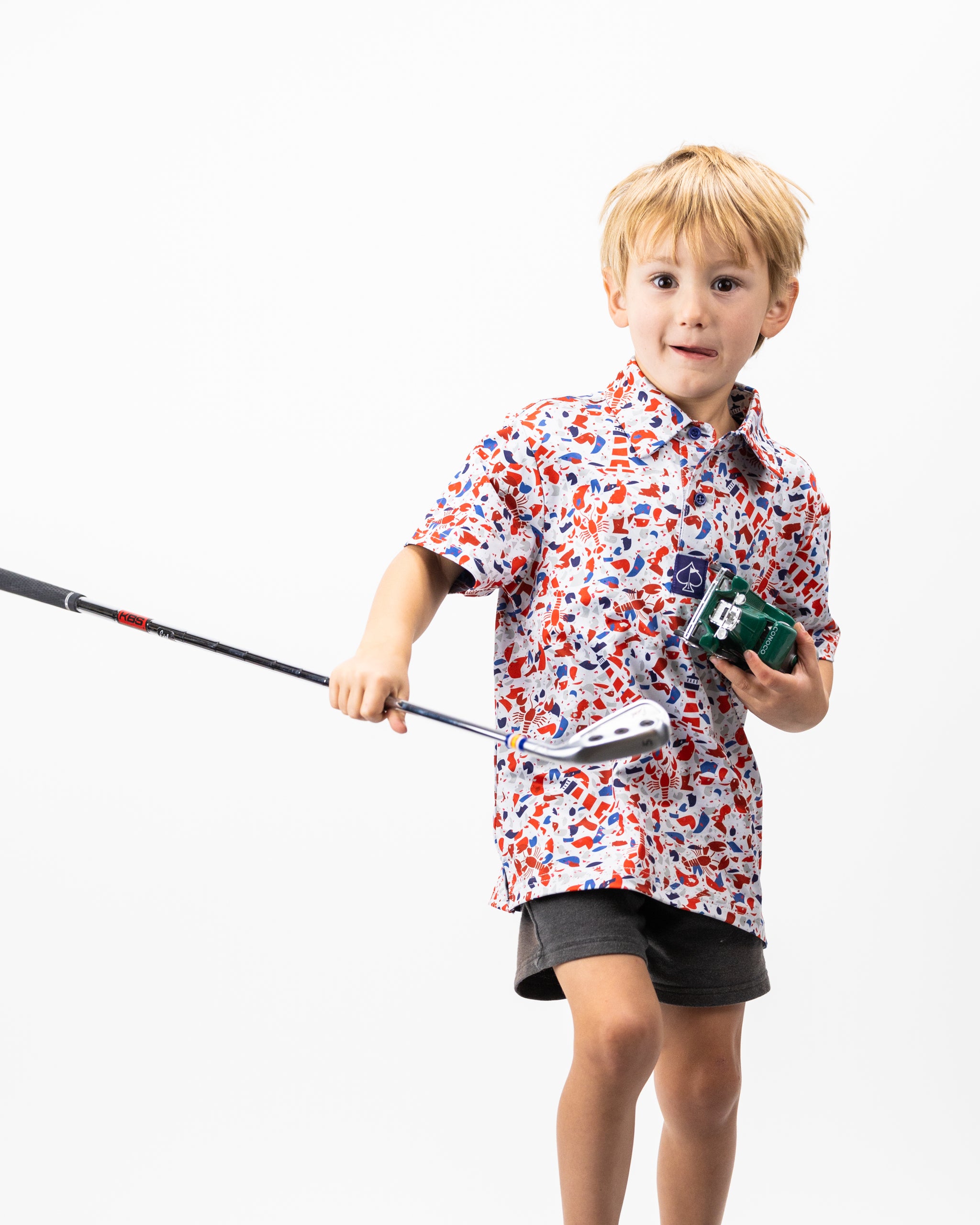 Youth Lobster Shatter: A vibrant, multicolored youth polo shirt featuring a playful lobster print, ideal for casual outings.