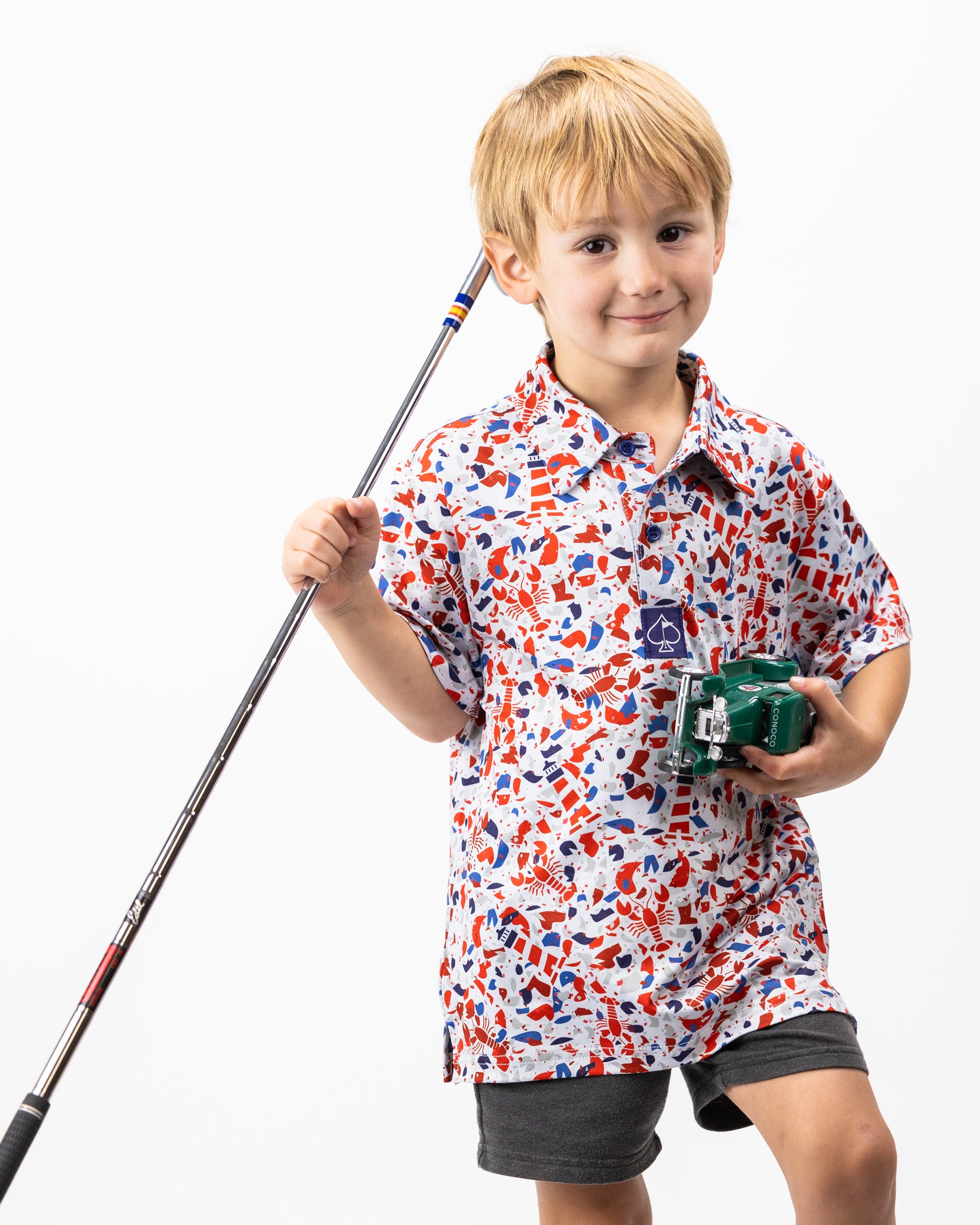 Youth Lobster Shatter long-sleeve polo shirt in vibrant red with lobster print design, featuring a classic collar and comfortable fit for kids.