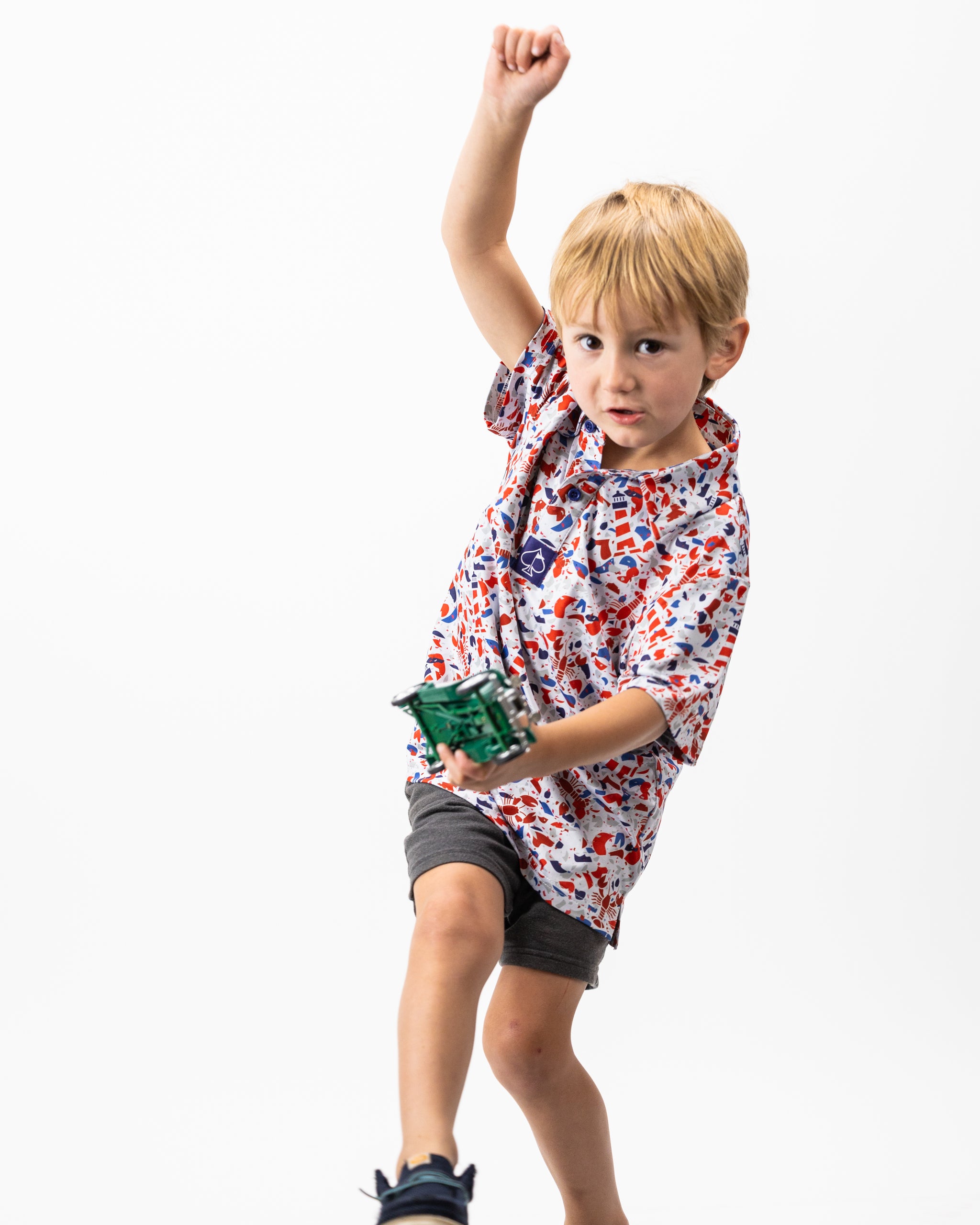 Youth Lobster Shatter polo shirt in vibrant red with stylish lobster graphic, ideal for casual or beach outings.