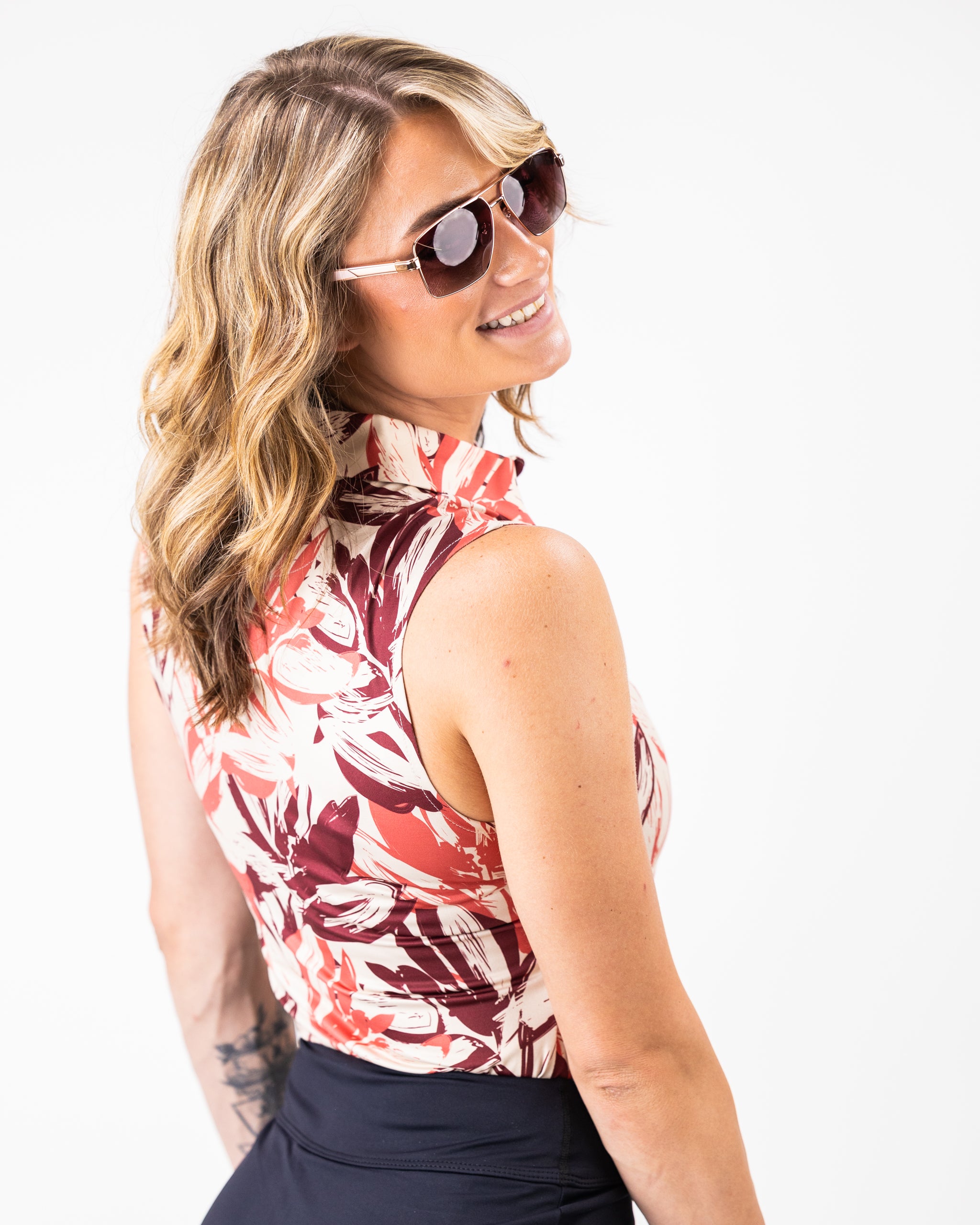 Women's brushed floral long-sleeve polo shirt in warm autumn colors.