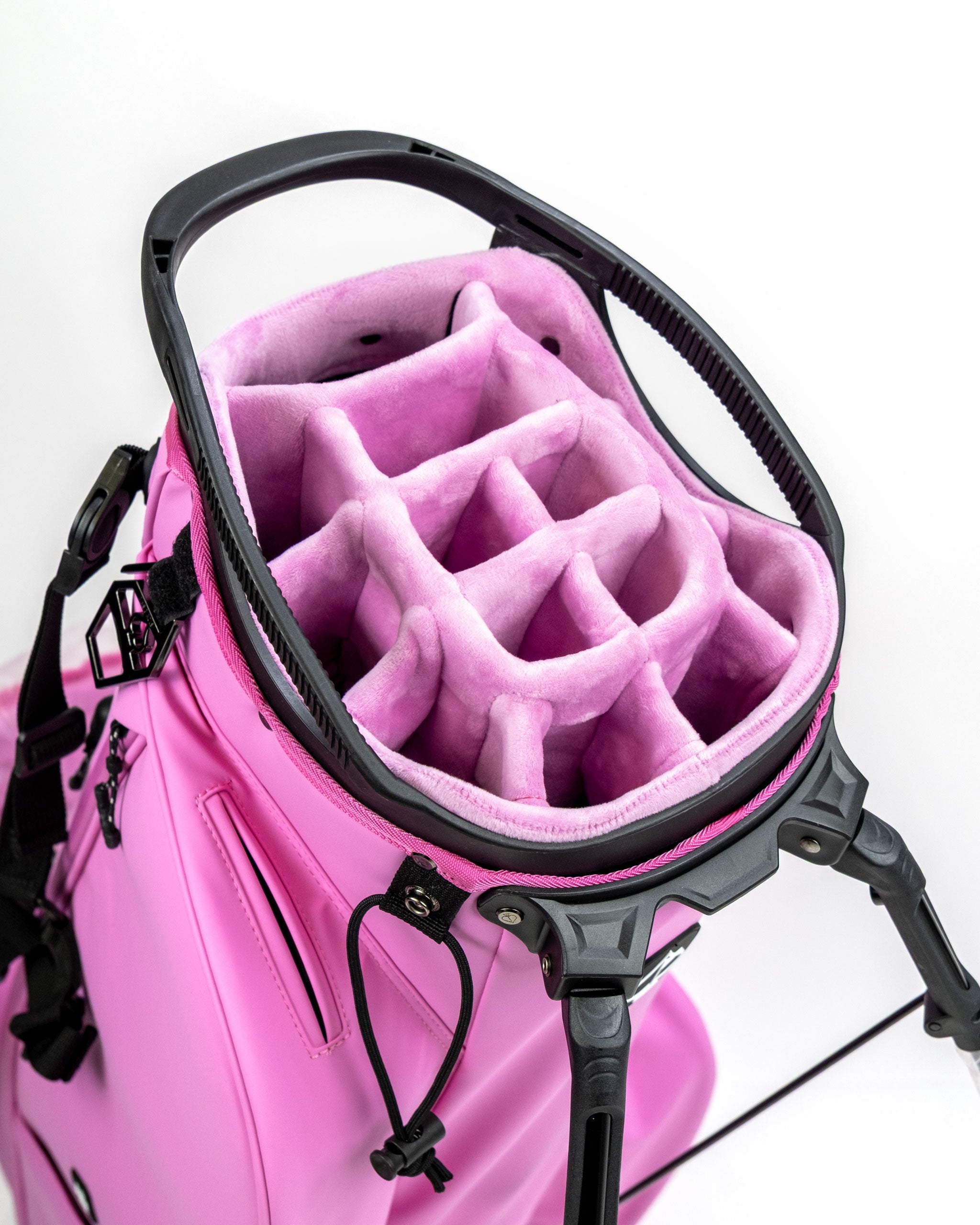 Top view of the Player Preferred Golf Bag in Bubblegum 2.0, showcasing a plush, organized interior with multiple club dividers.