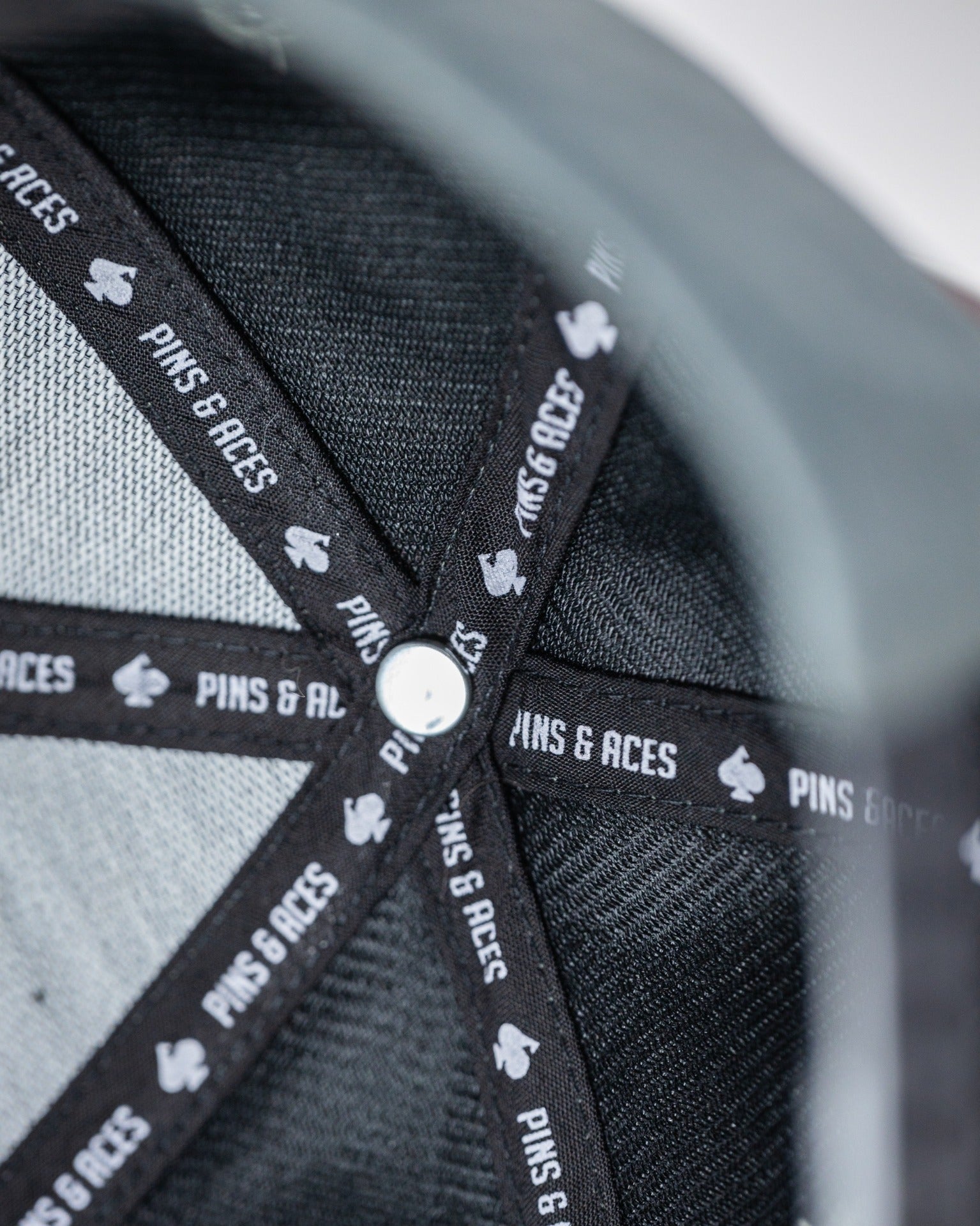 Interior view of the Performance Spade Hat in Ash, showcasing the branded lining and structured design for comfort.