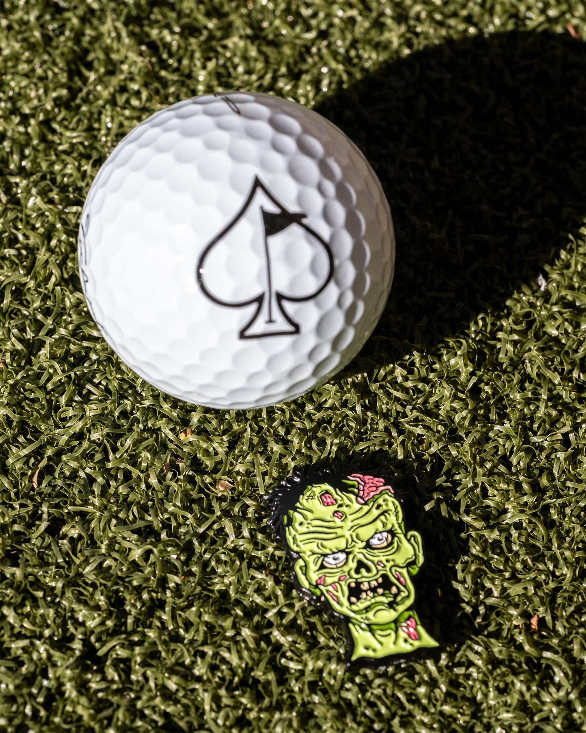 "Mutant Zombie ball marker featuring a detailed zombie design, perfect for Halloween-themed golf accessories."