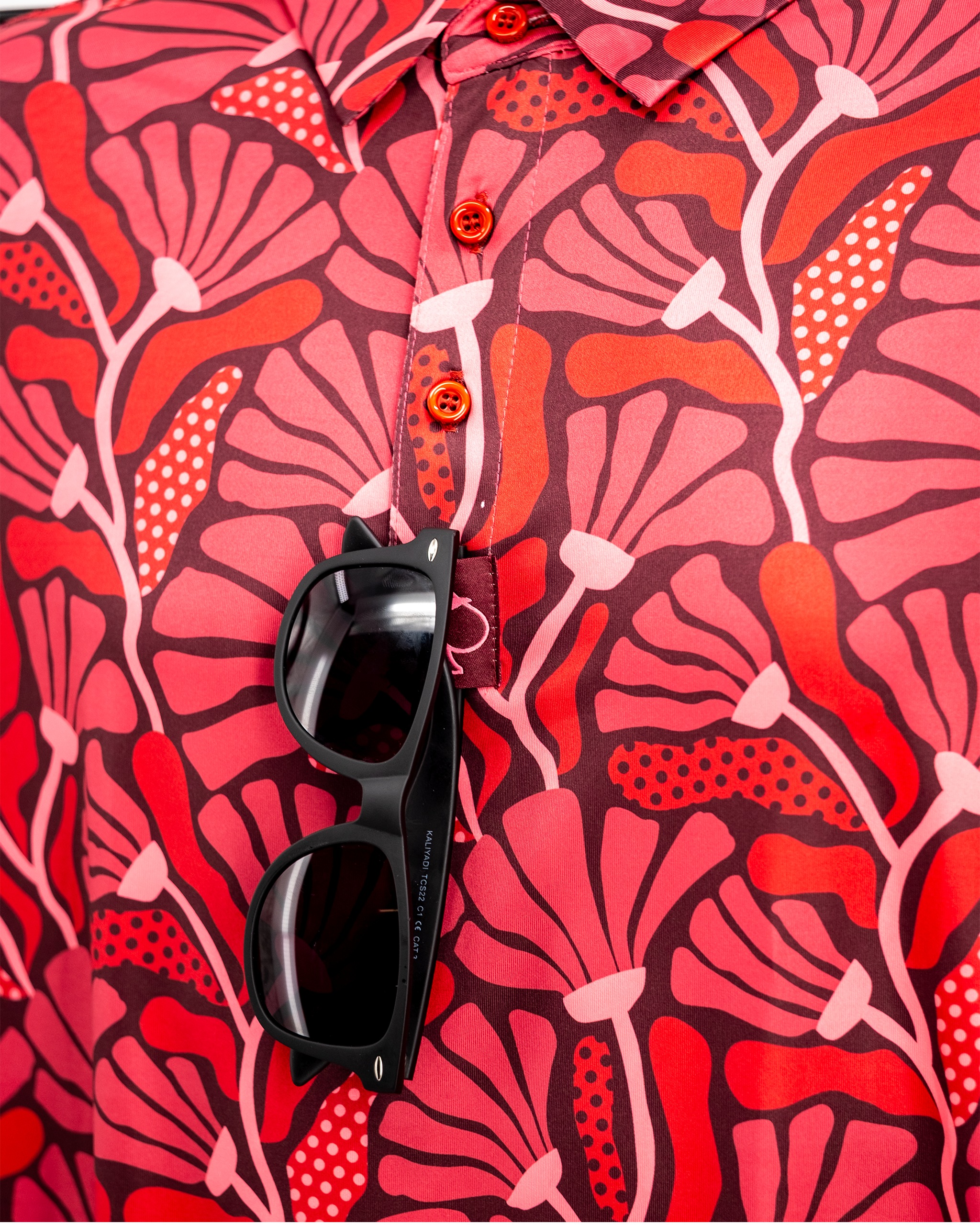 Garden Party Crimson Bloom floral design featuring vibrant red and pink blooms on a white background.