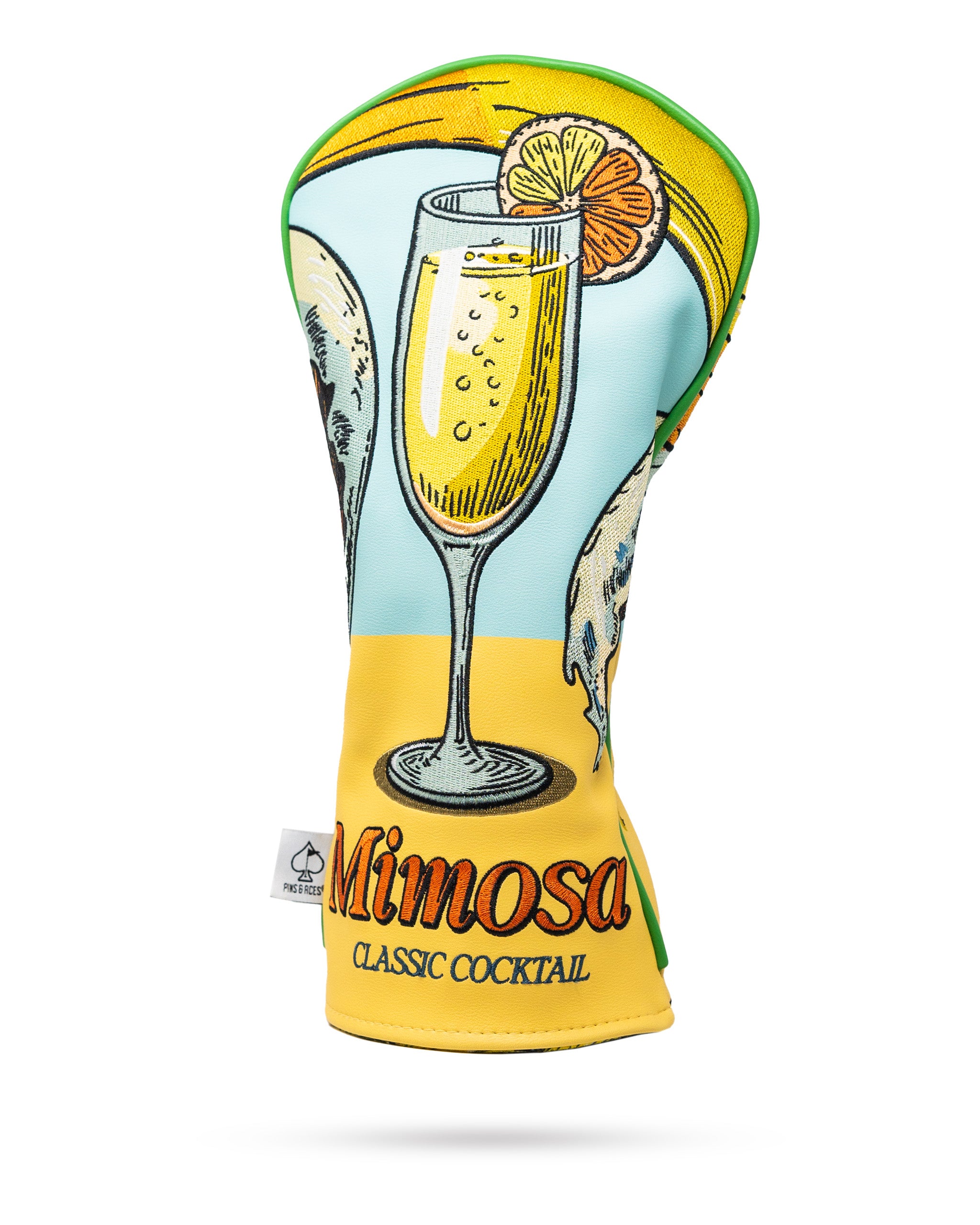 Mimosa driver cover featuring a vibrant orange and yellow design with a playful champagne glass and citrus slice motif.