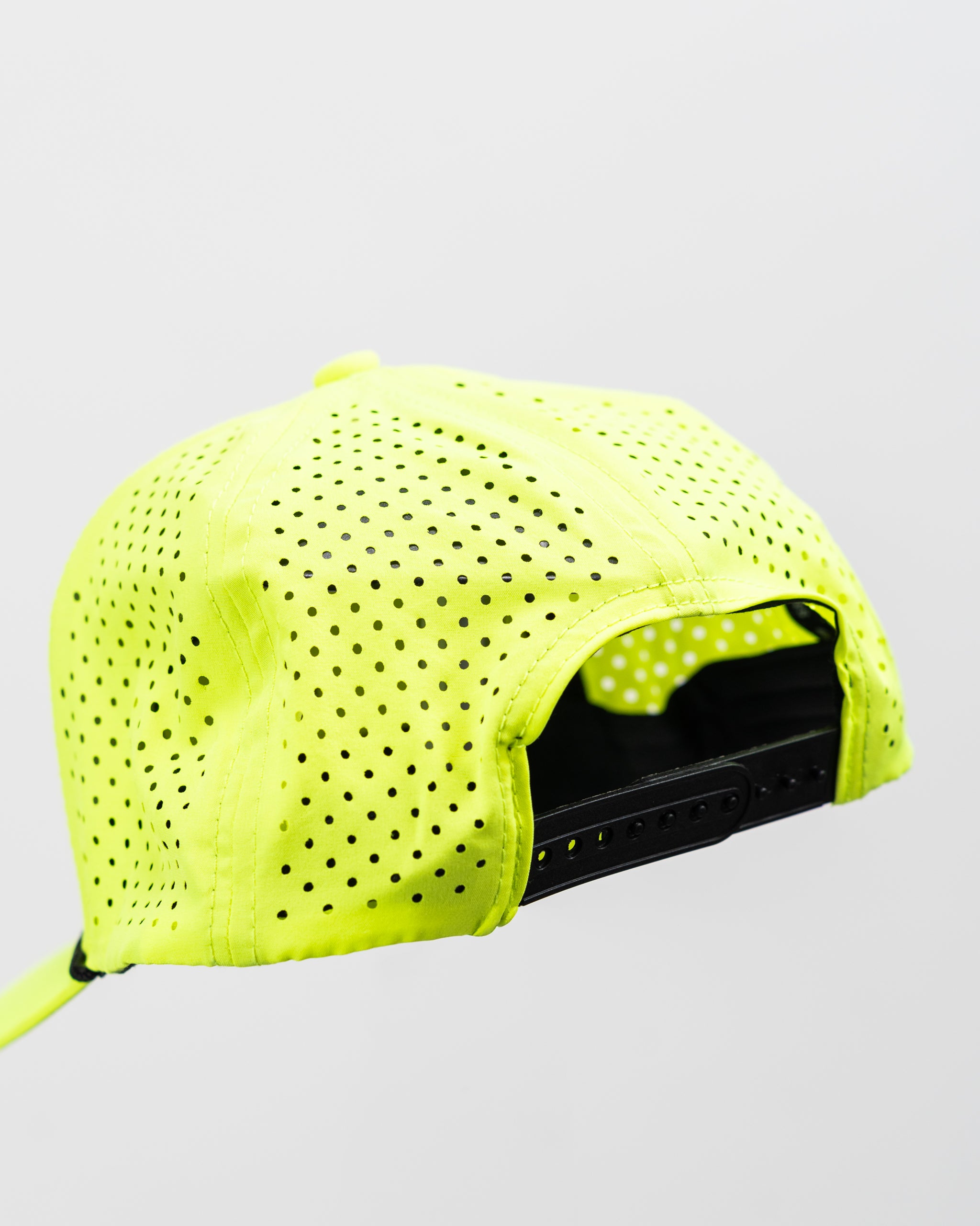 Perforated rope hat in highlighter yellow with a snapback design.