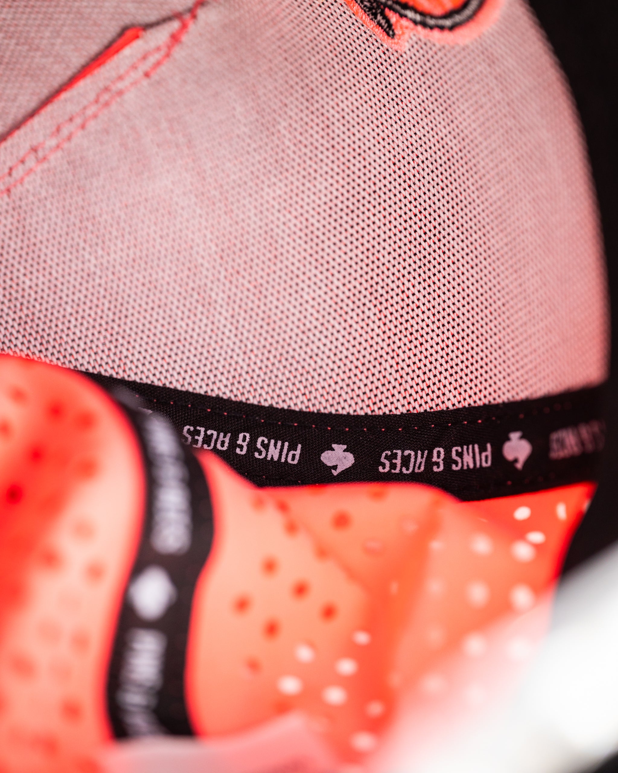 Perforated rope hat in highlighter pink, featuring a wide brim and bold design, ideal for summer activities.