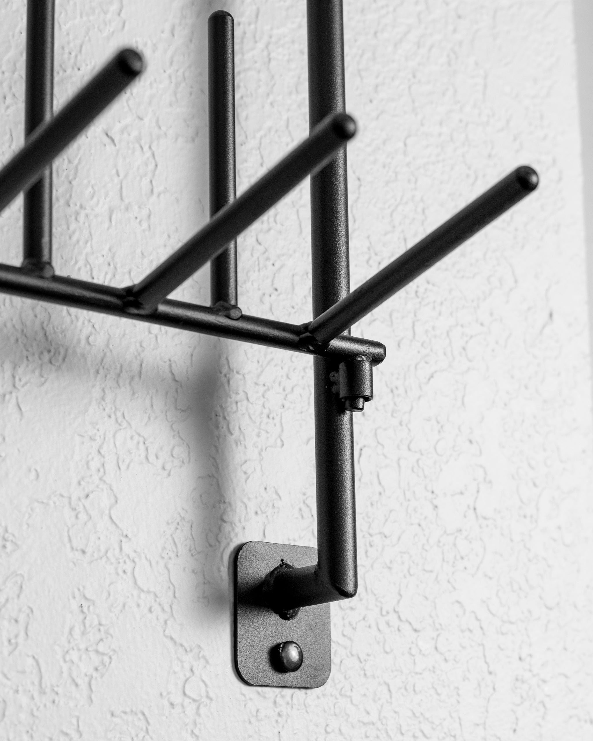 "Headcover Rack displaying multiple golf headcovers organized on a sleek wooden stand."