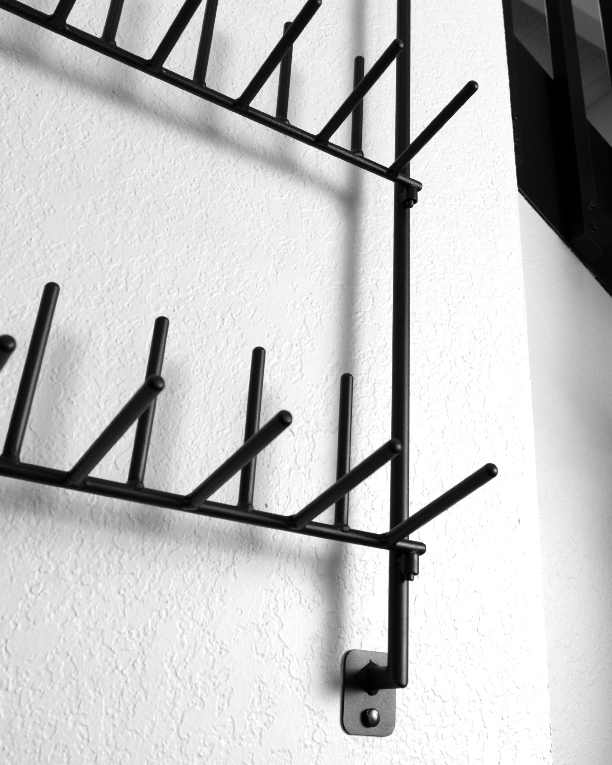 Headcover rack displaying multiple colorful golf headcovers organized for easy access.