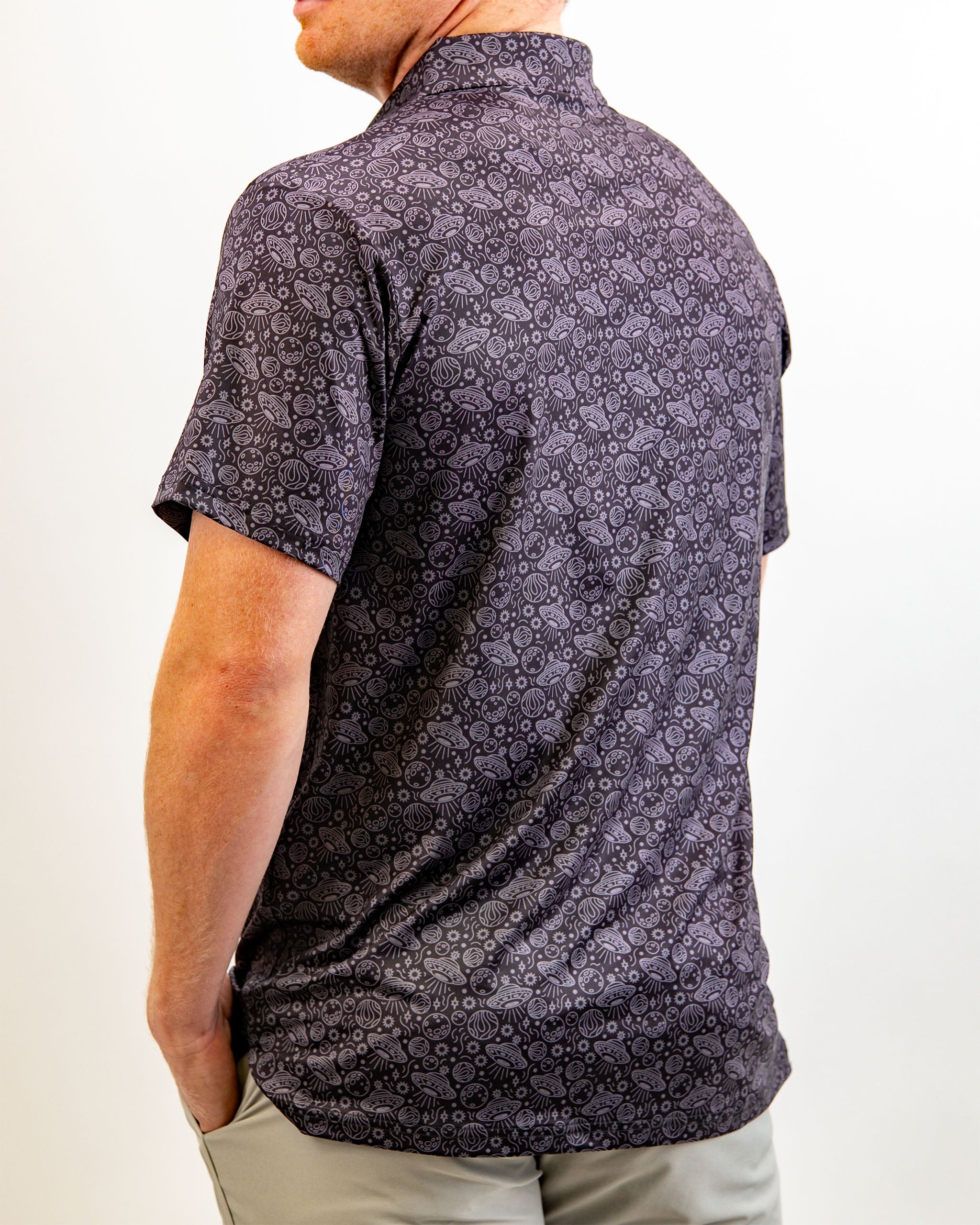 Men's HEYDUDE Black Hole polo shirt featuring a stylish design and breathable fabric.