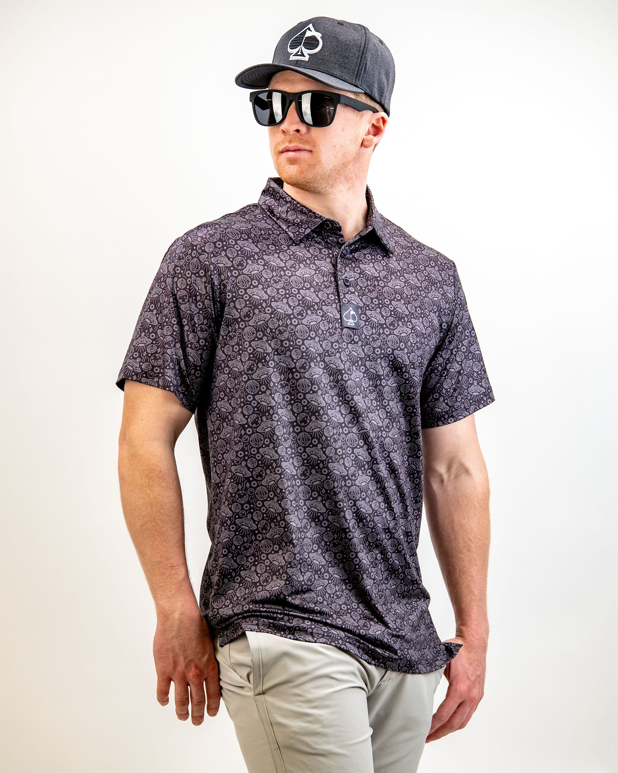 Men's HEYDUDE Black Hole polo shirt with a sleek design and breathable fabric.