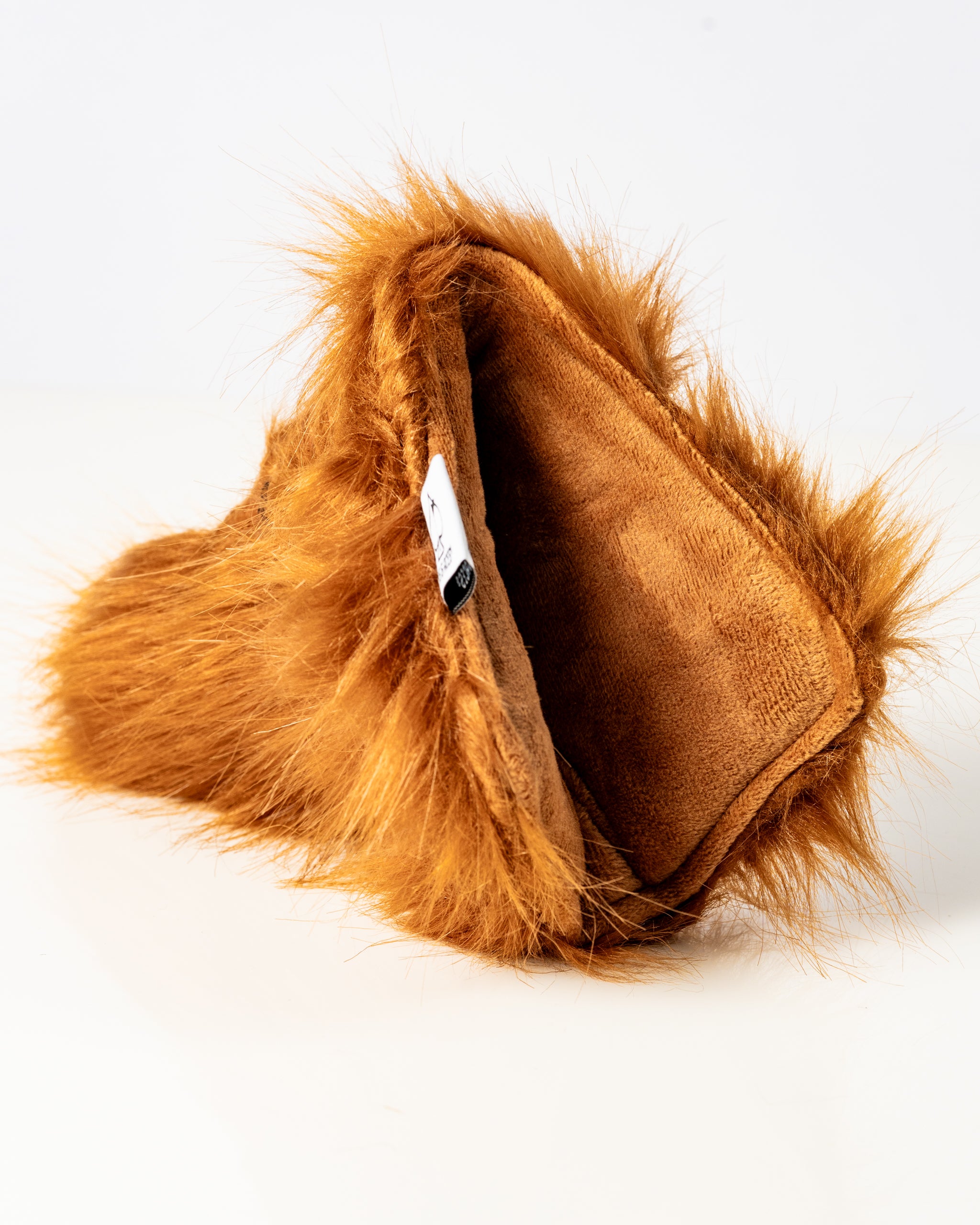 Highland cow blade putter cover with soft, furry exterior and plush interior, designed for golfers seeking unique style.