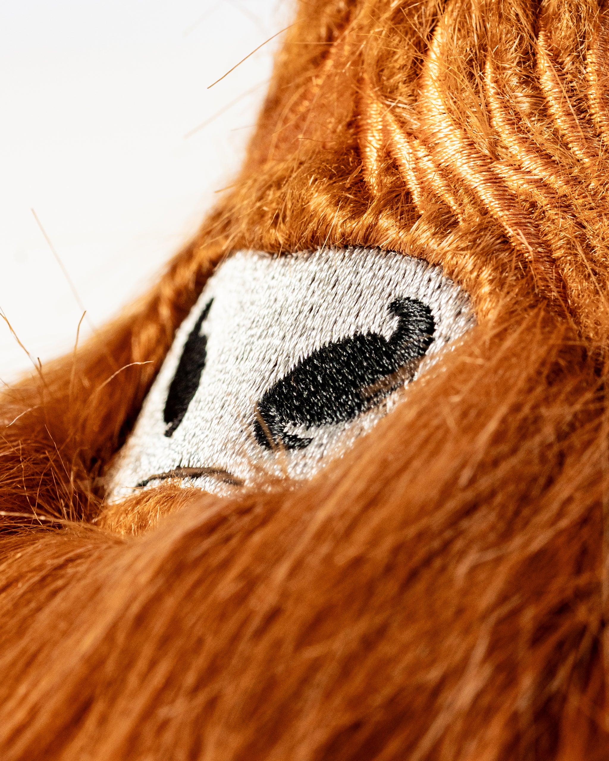 Highland cow blade putter cover featuring a detailed embroidered face and vibrant orange fur for a bold golf accessory.