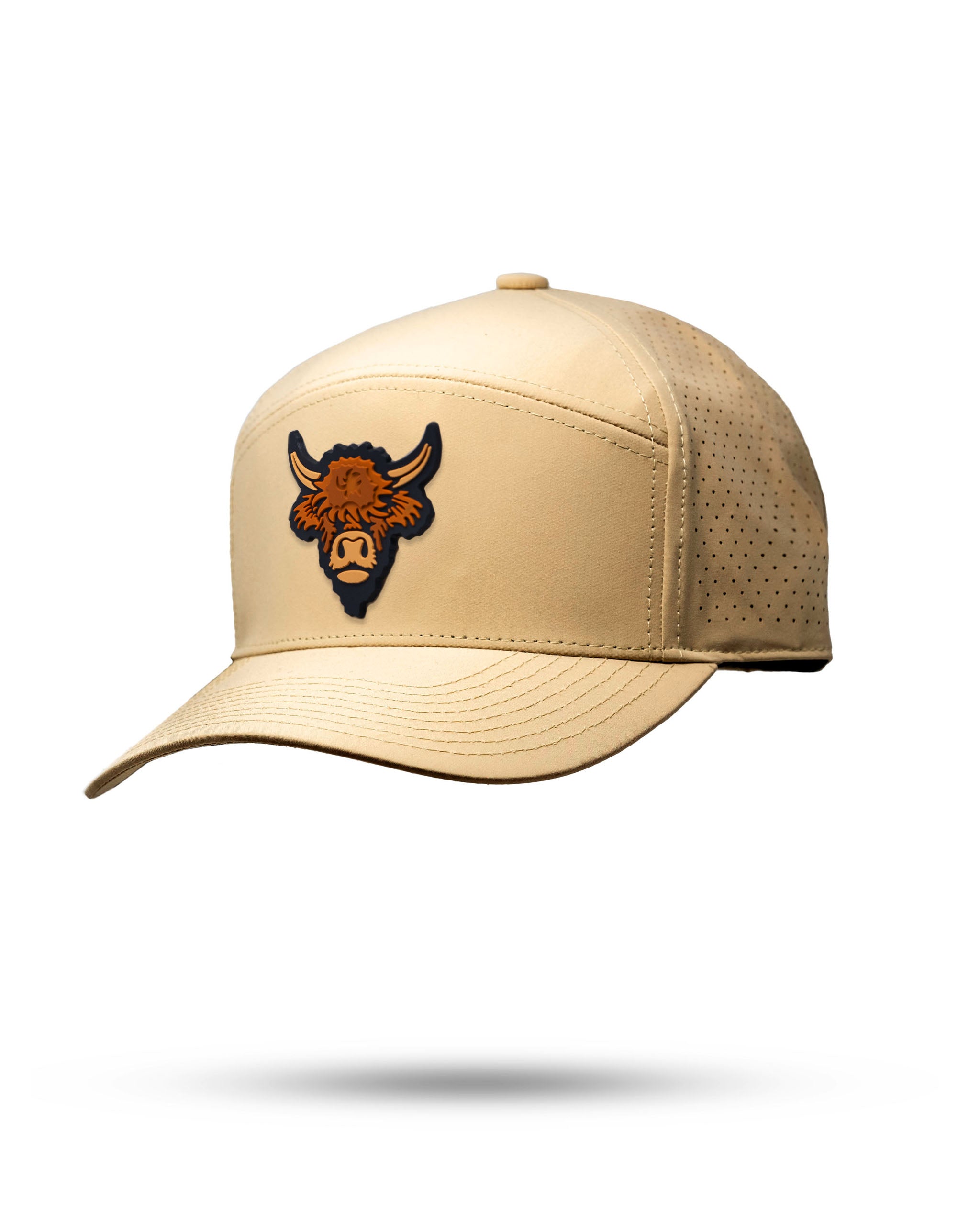 Sand-colored tradesman hat with a Highland Cow logo patch on the front and perforated sides for breathability.