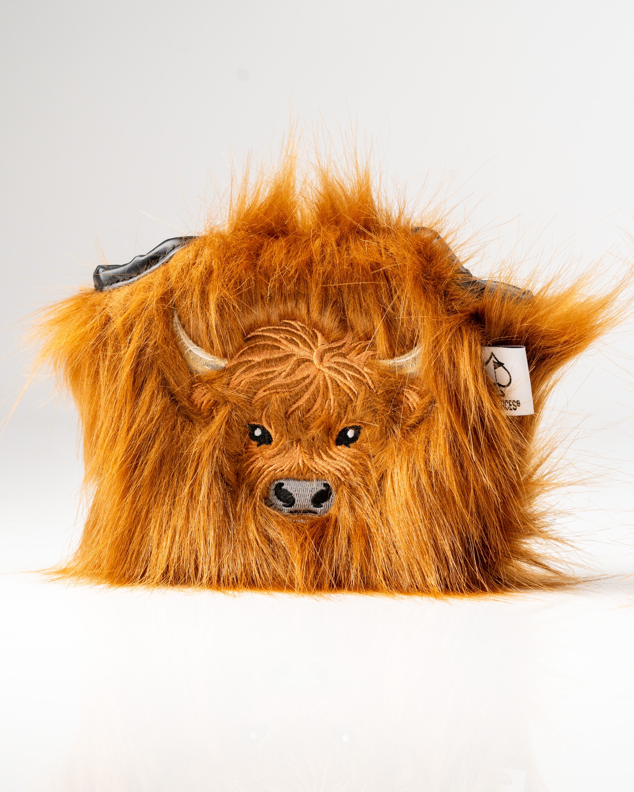 Highland cow mallet putter cover with realistic fur texture and detailed facial features, perfect for unique golf style.