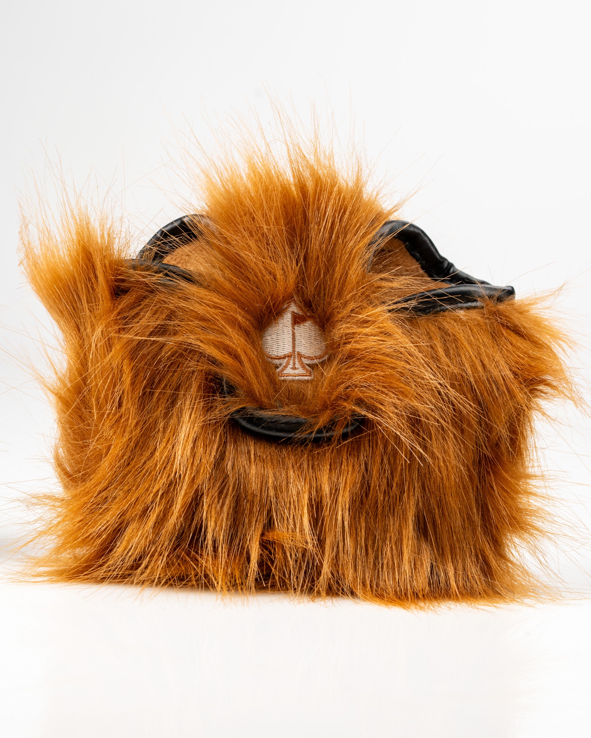 Highland cow mallet putter cover with a fluffy orange exterior and a black trim, designed for golfers seeking unique style.