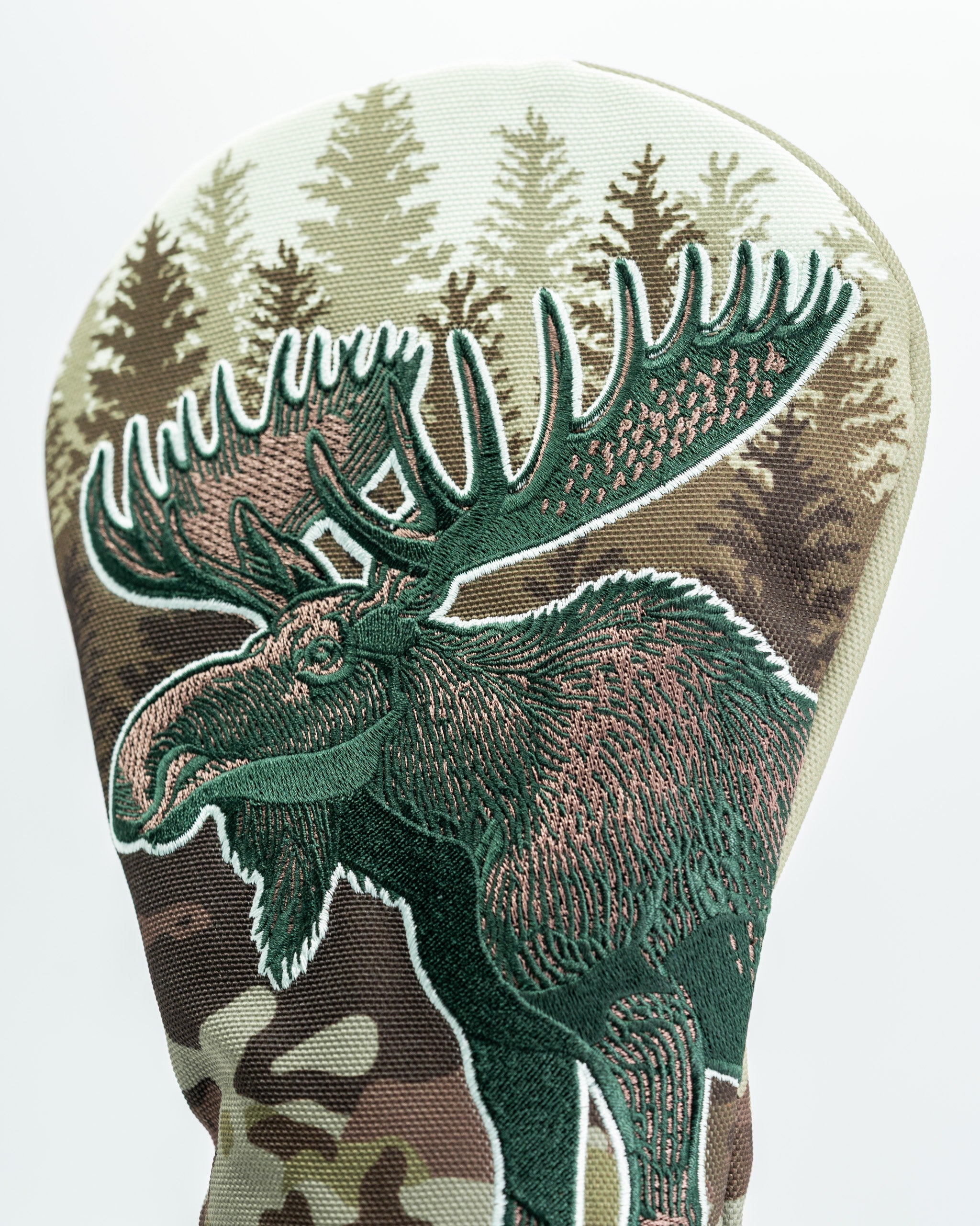 Moose driver cover featuring detailed embroidery and a camouflage background, perfect for bold golf style on the course.