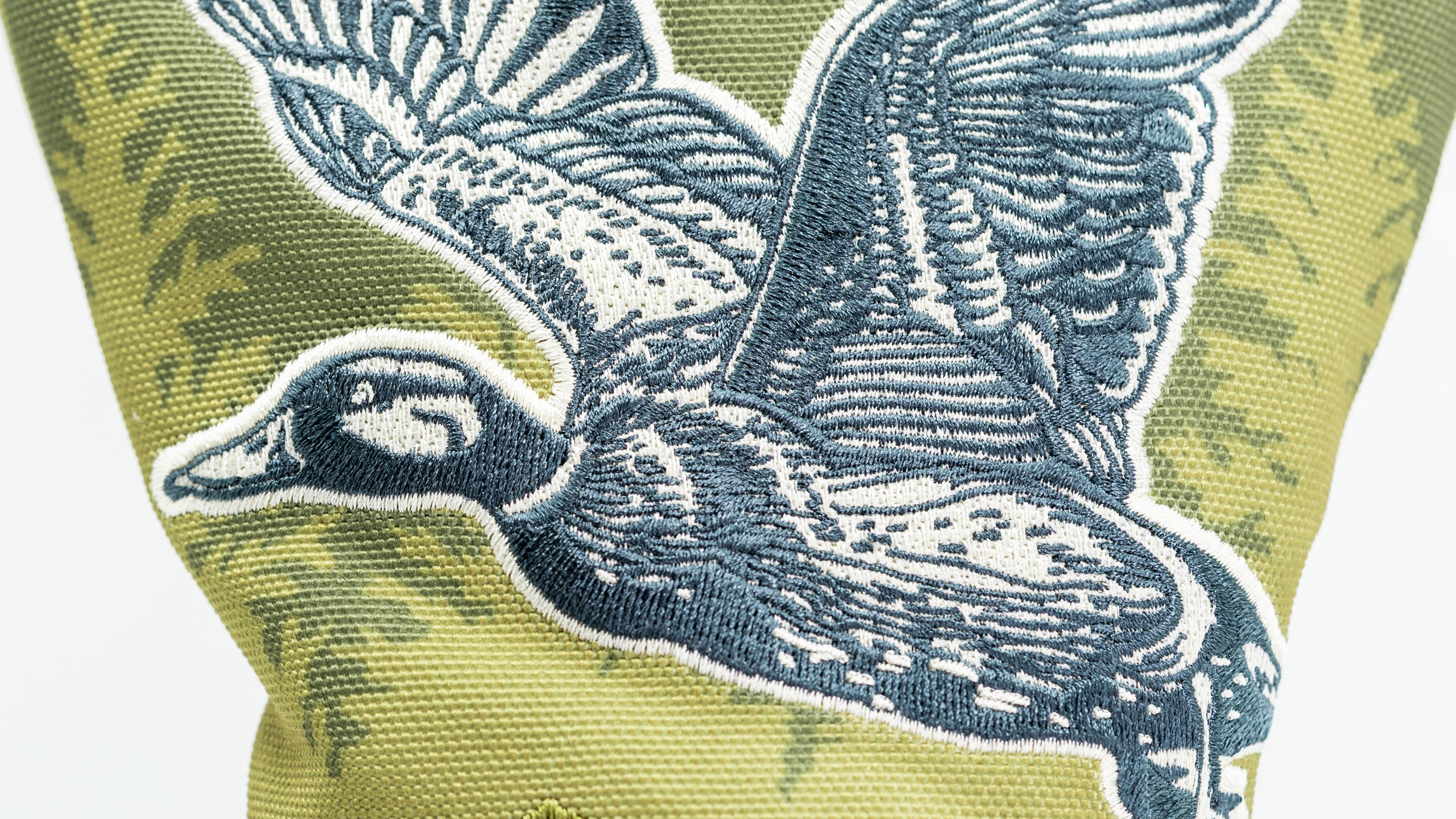 Open Season Mallard driver cover featuring an embroidered flying duck design on a textured green background.