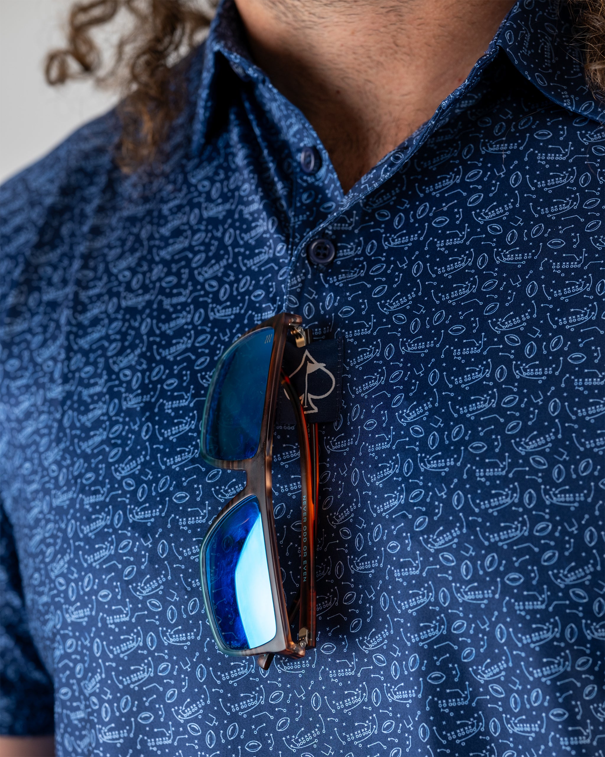 Model wearing the Playmaker sports gear in an action pose, showcasing its design and functionality.