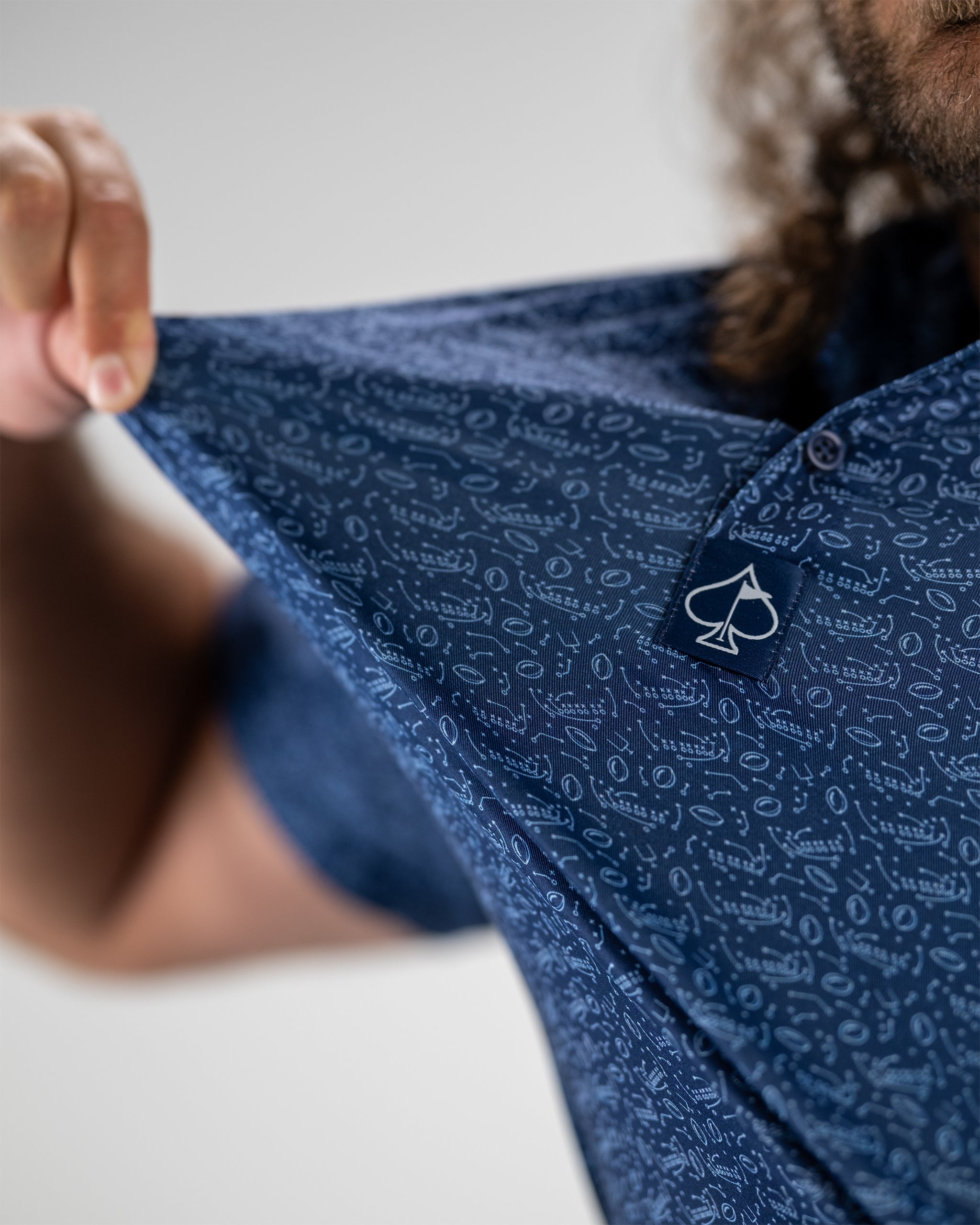 Male model demonstrating the Playmaker fishing rod, showcasing its sleek design and ergonomic grip.