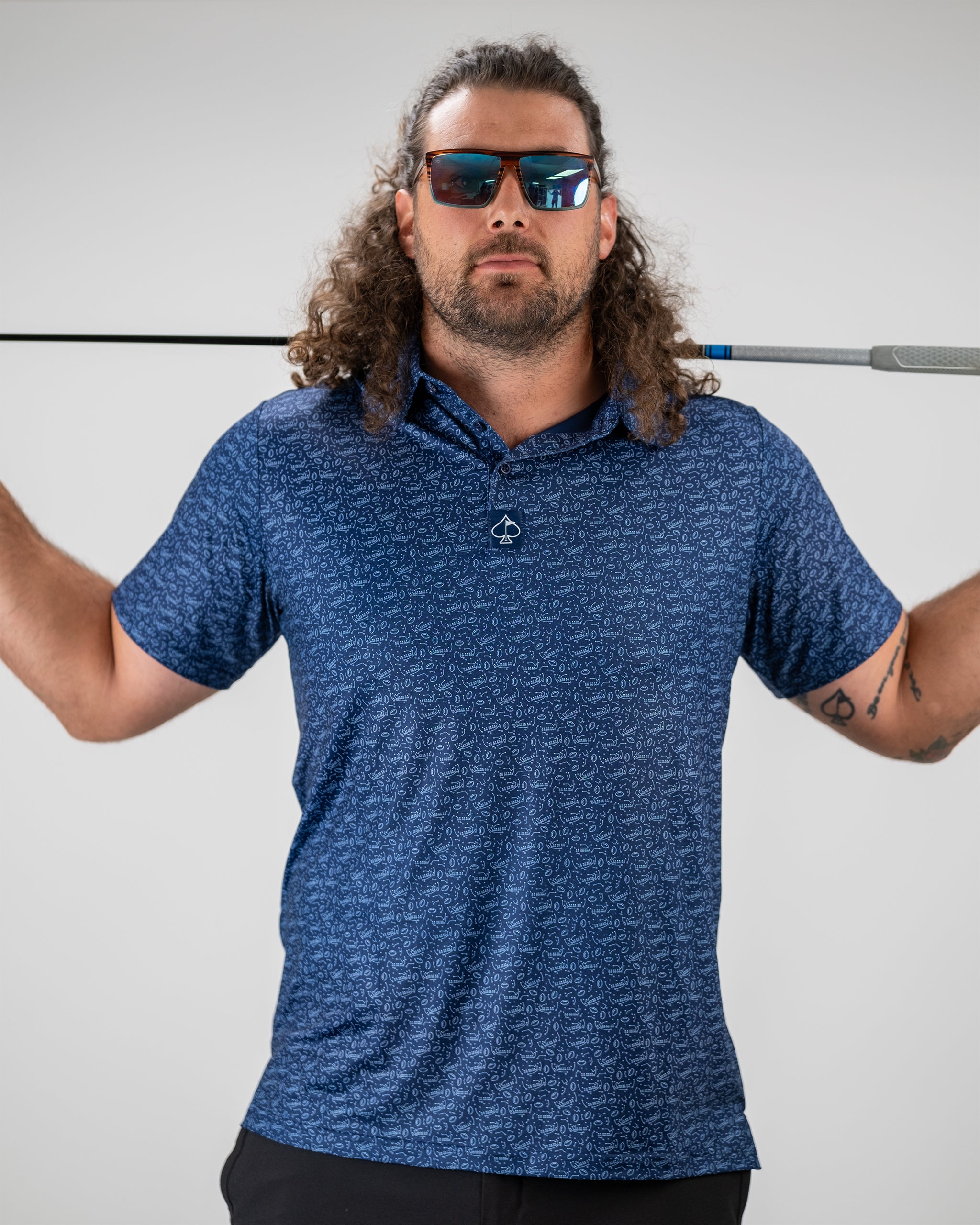 Playmaker product shot featuring a model demonstrating a catch-and-release fishing technique, showcasing the fishing gear in an outdoor setting.