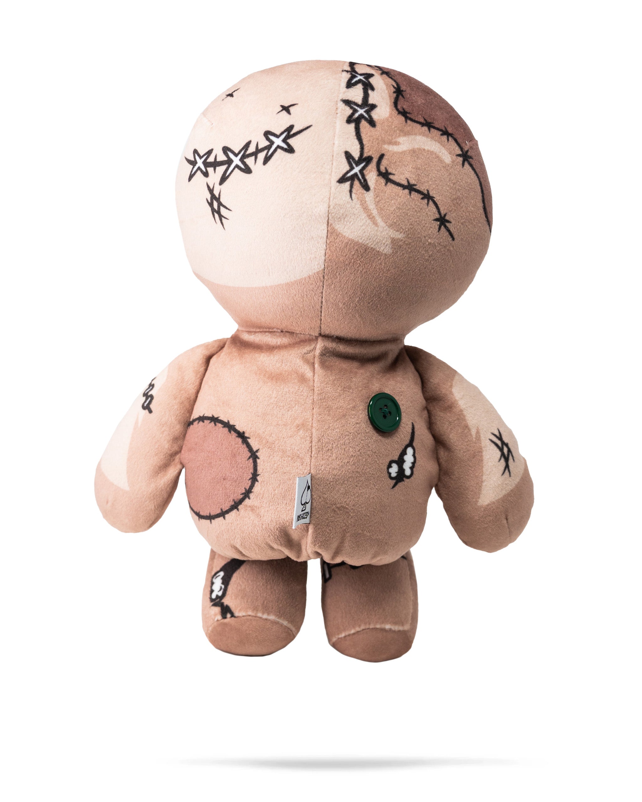 Soft plush voodoo doll driver cover with stitched details, black embroidery, and a green button, designed to protect golf clubs.